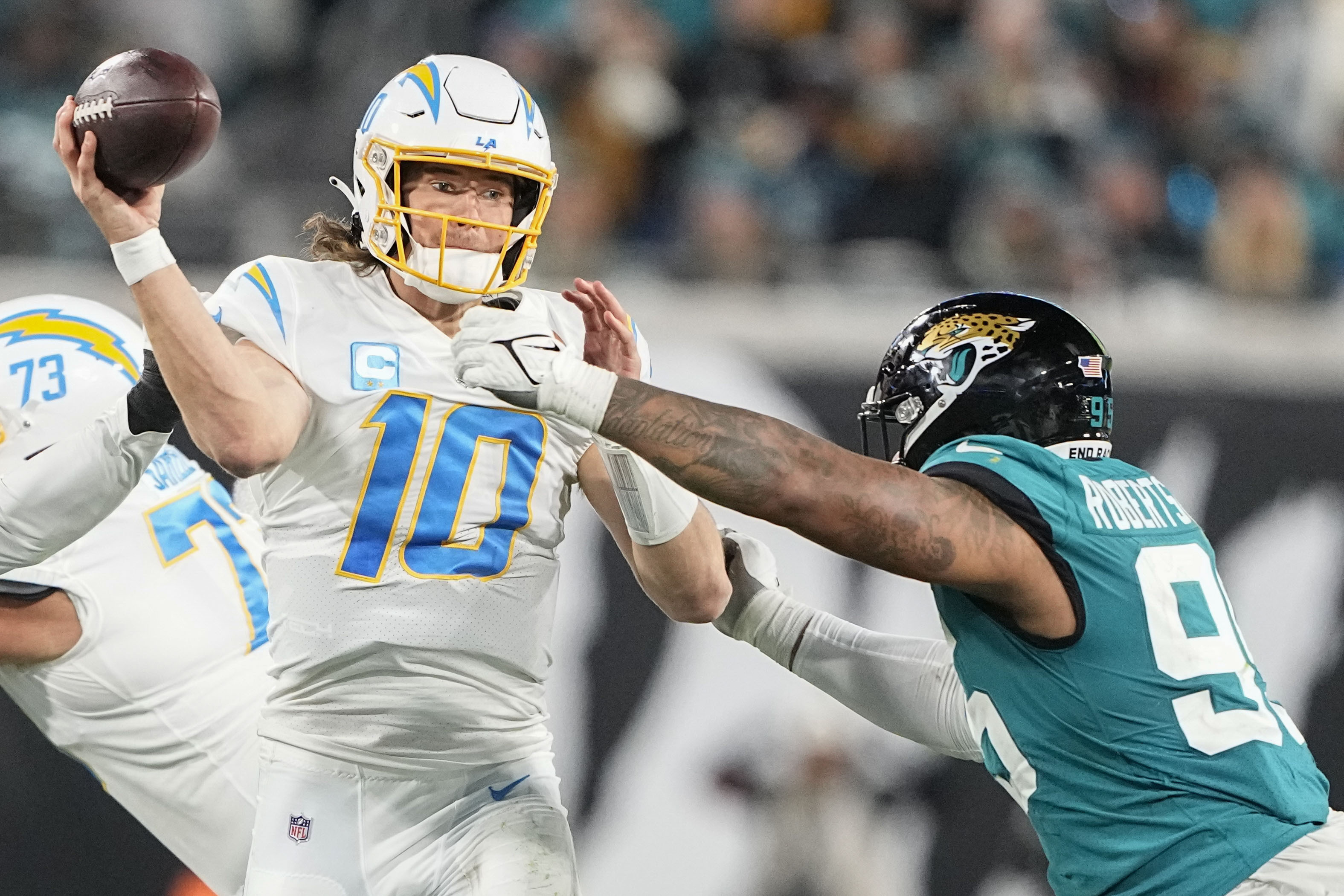 Jacksonville Jaguars wide receiver Marvin Jones Jr. (11) runs onto the  field for an NFL wild-card football game against the Los Angeles Chargers,  Saturday, Jan. 14, 2023, in Jacksonville, Fla. (AP Photo/Gary