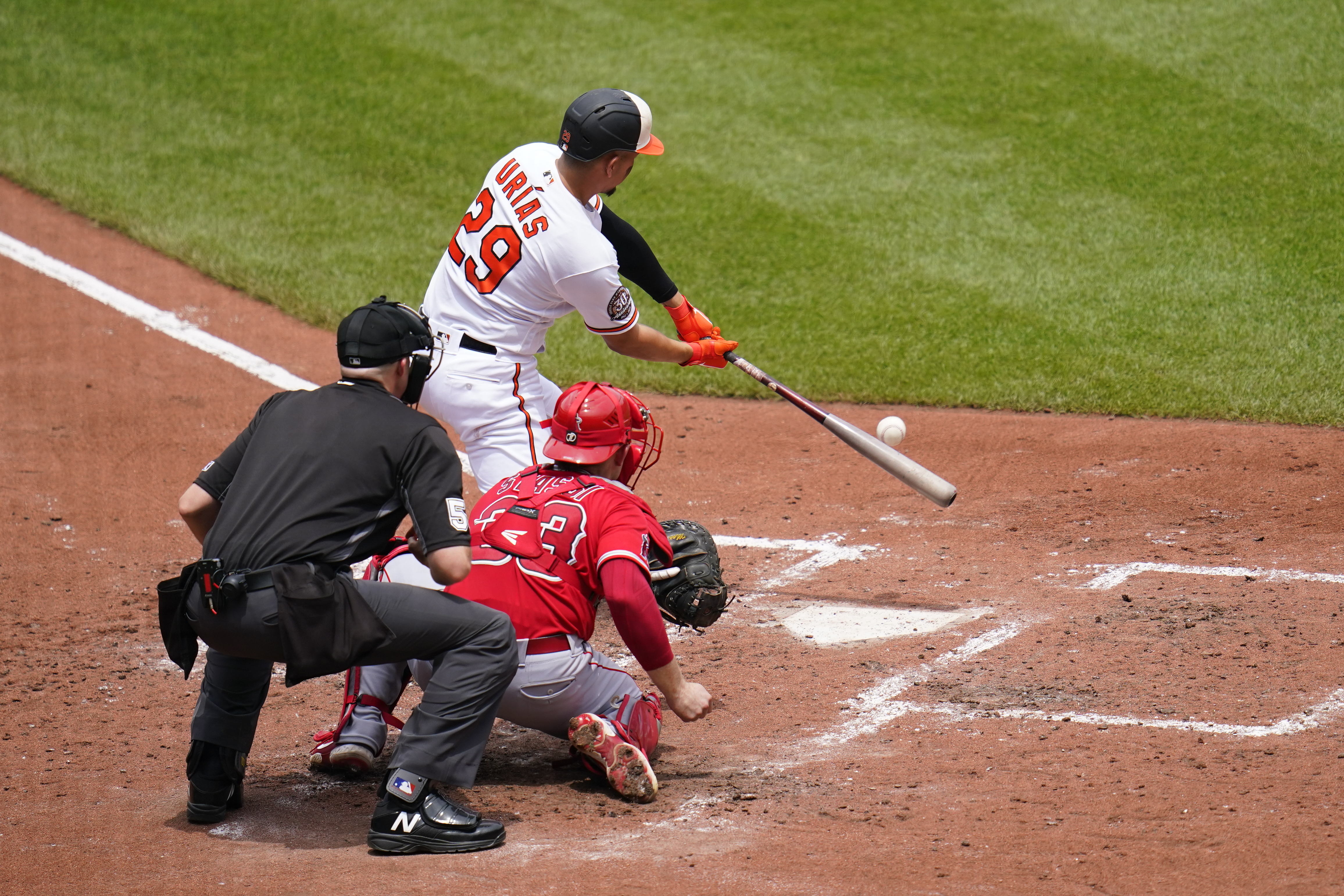 Ramon Urias of the Baltimore Orioles triples against the Houston