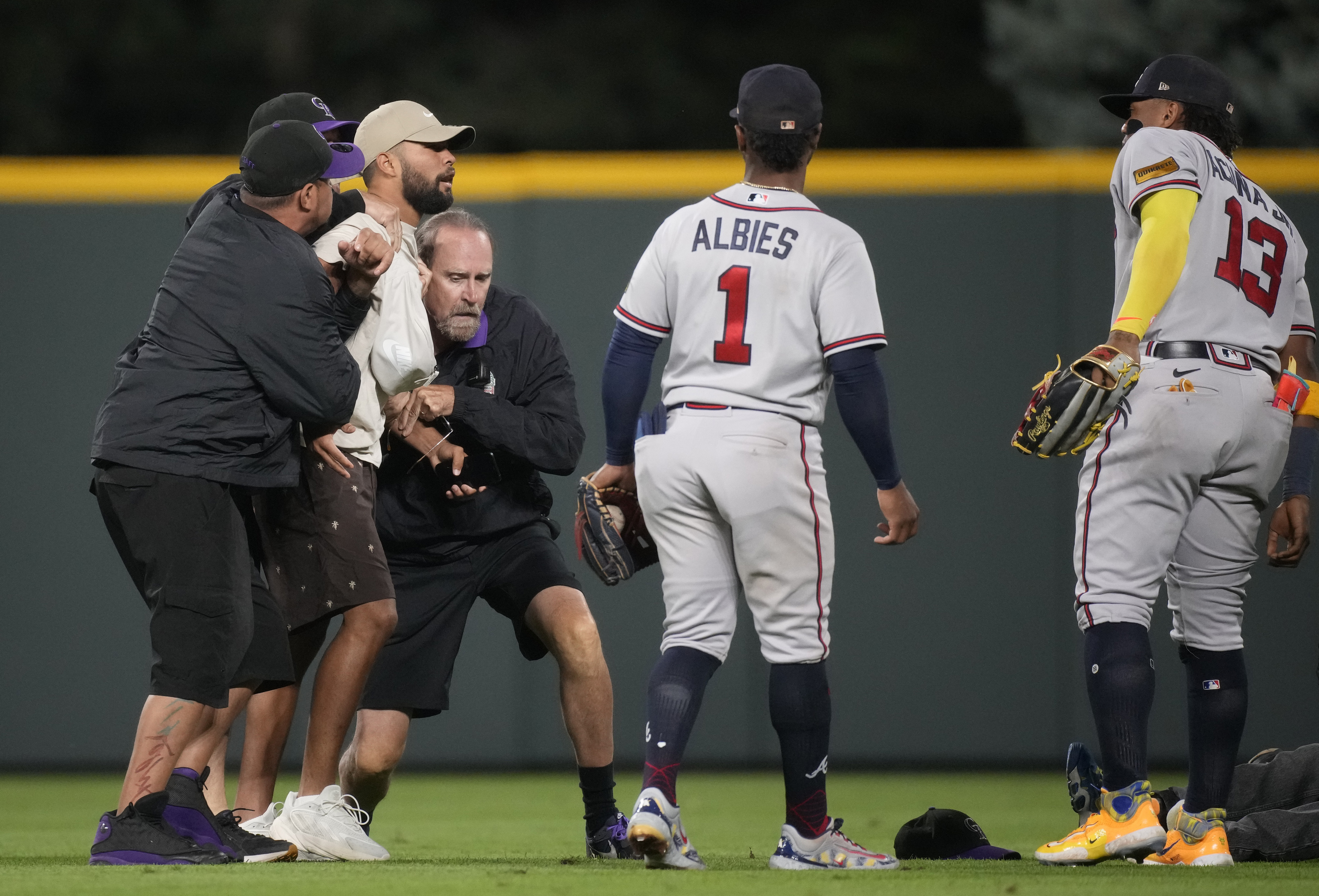 Ronald Acuña Jr. knocked over by fan charging field in Colorado, but Braves  star says he's OK – KXAN Austin