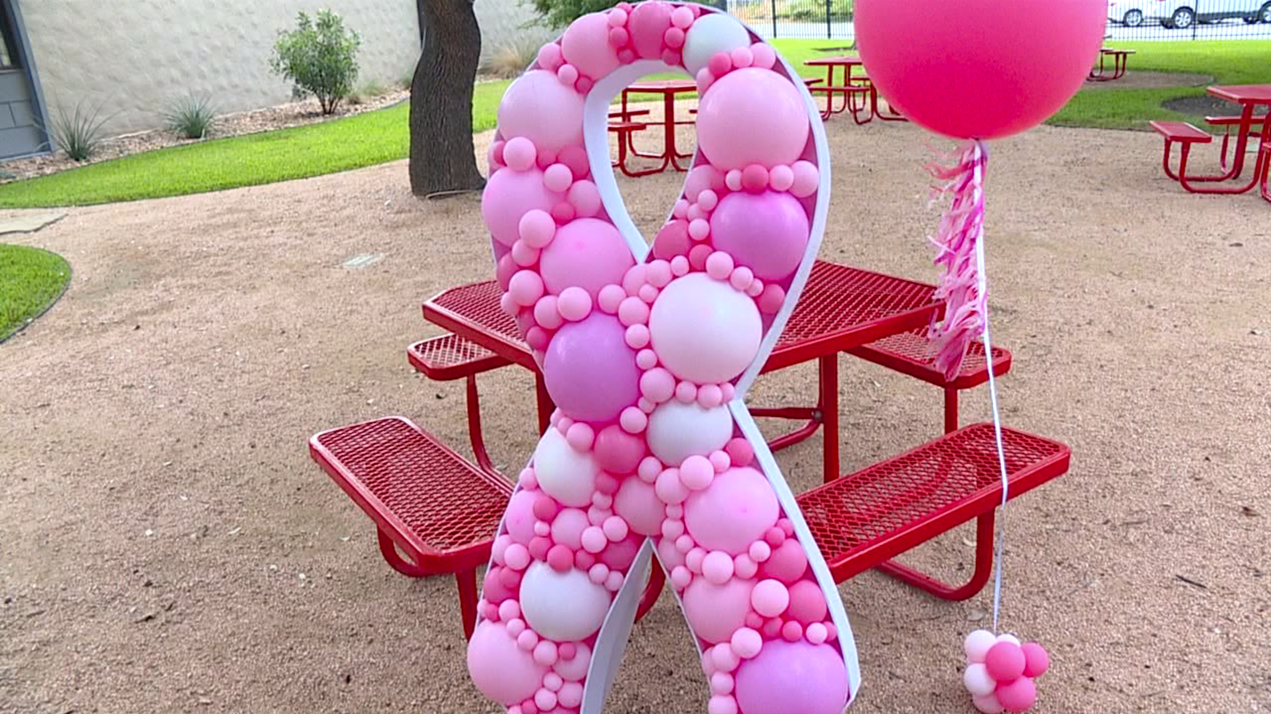 breast cancer awareness ribbon made of balloons