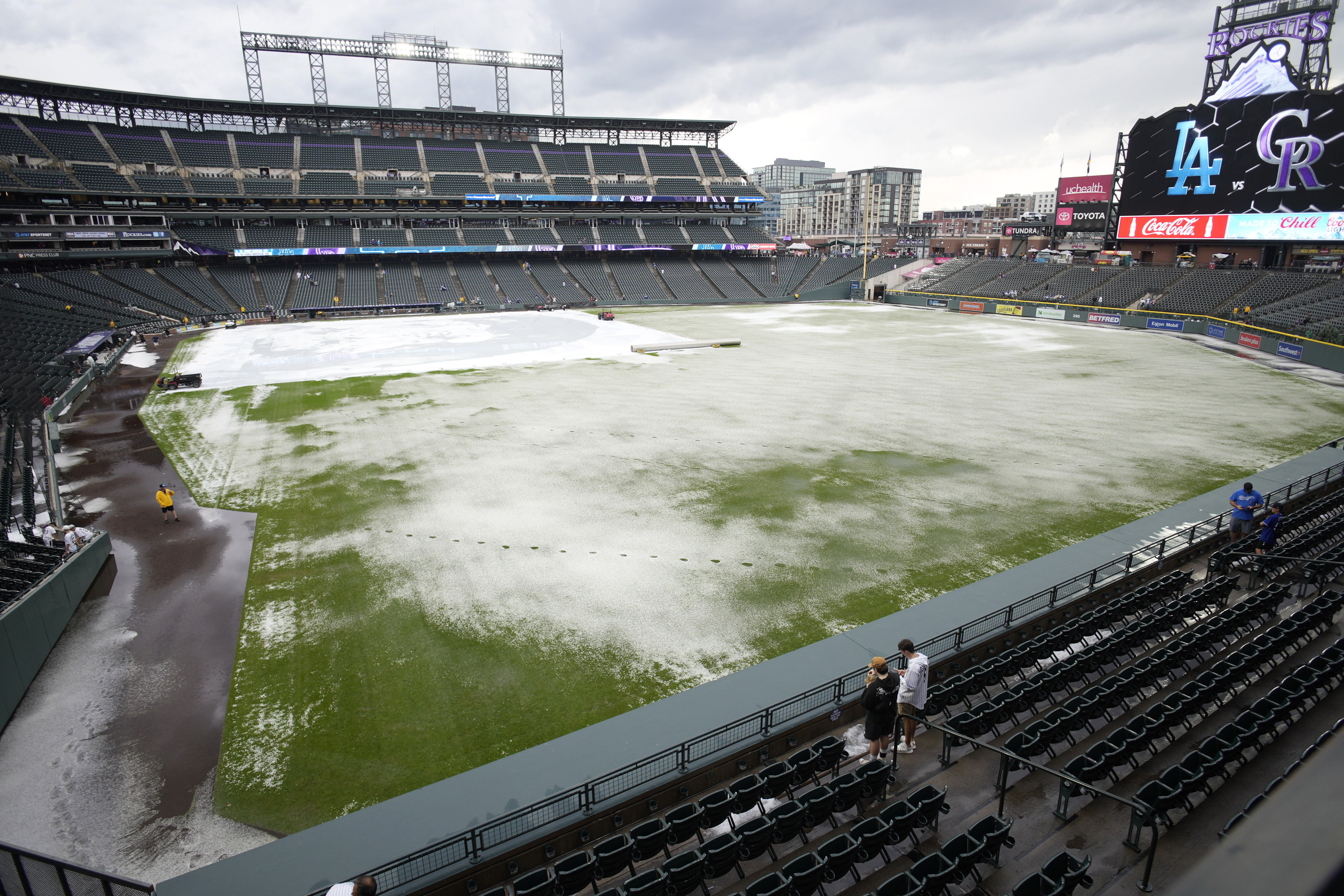 Blanket of hail, flash flooding create wild scene at Coors Field