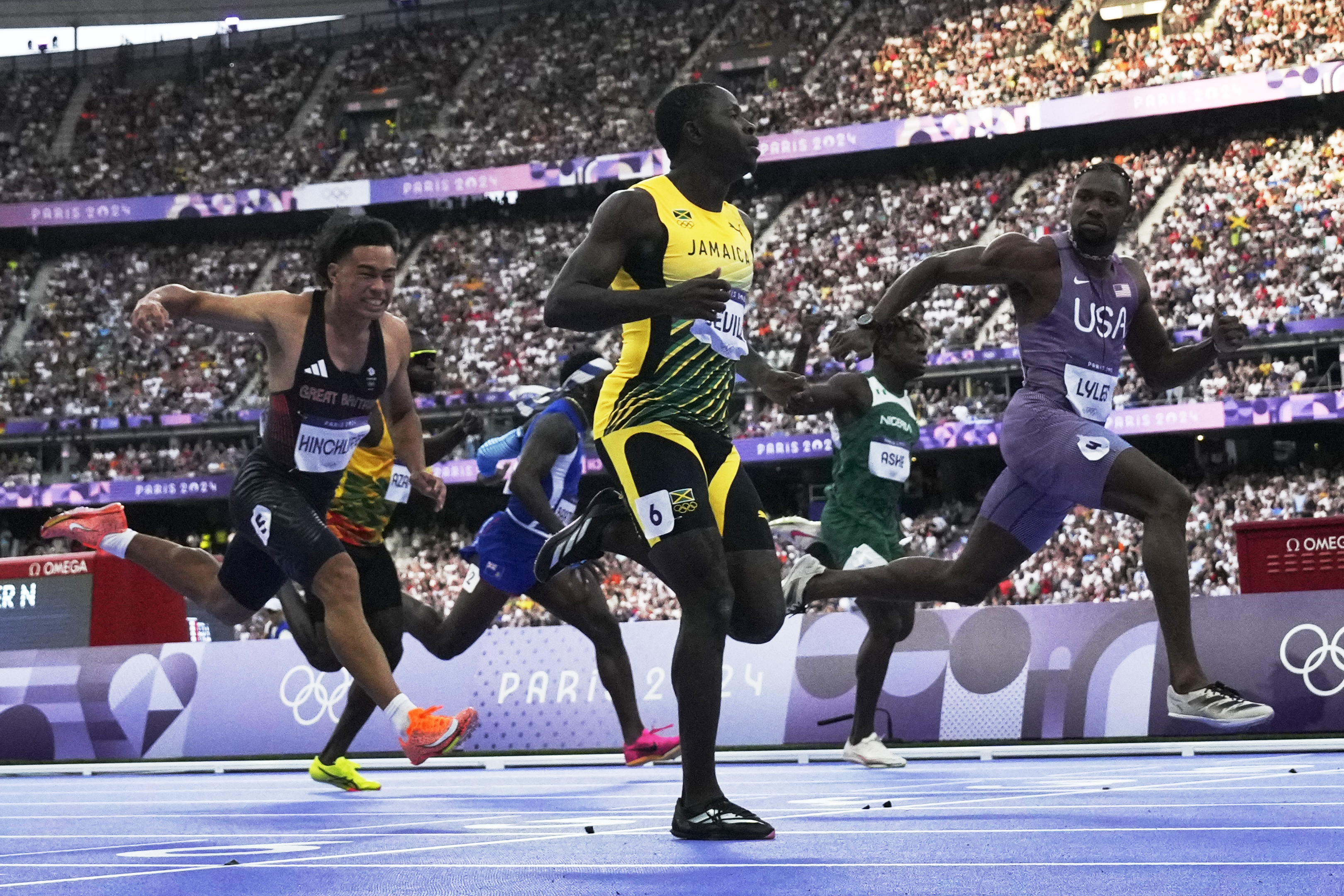 Noah Lyles wins a historically close Olympic 100-meter sprint by