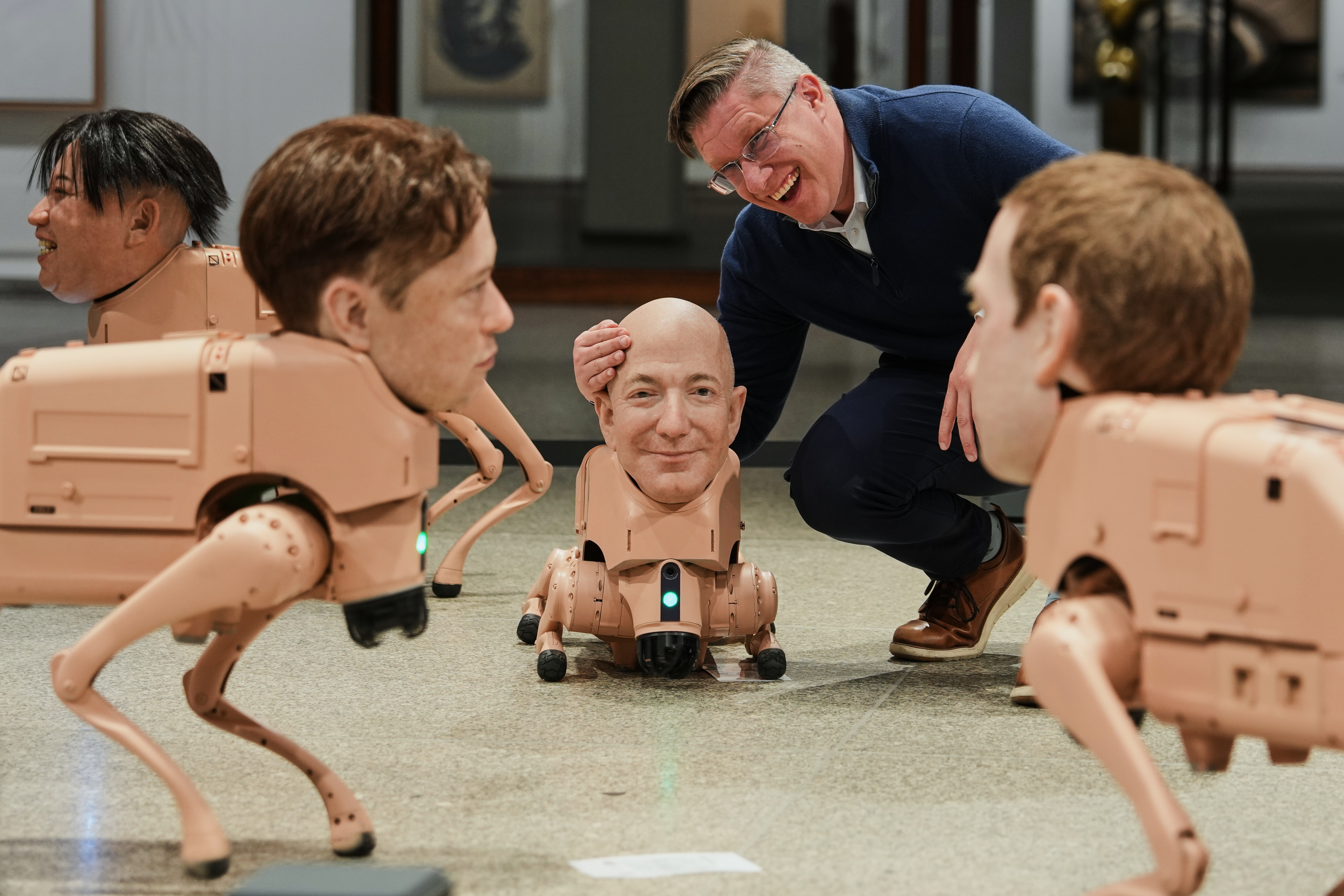 Robot dogs with Musk and Zuckerberg heads roam around Berlin