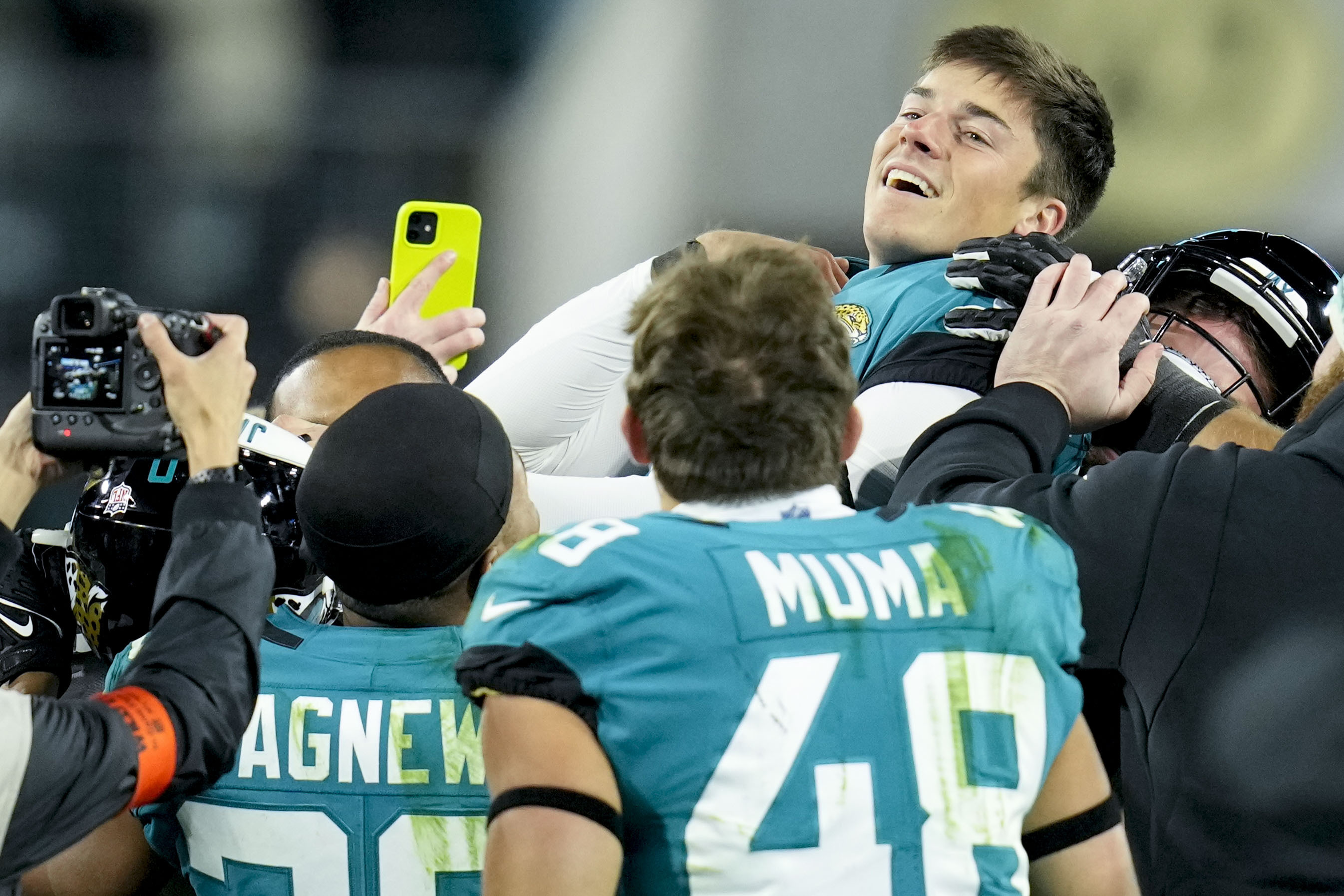 Jacksonville Jaguars wide receiver Marvin Jones Jr. (11) runs onto the  field for an NFL wild-card football game against the Los Angeles Chargers,  Saturday, Jan. 14, 2023, in Jacksonville, Fla. (AP Photo/Gary