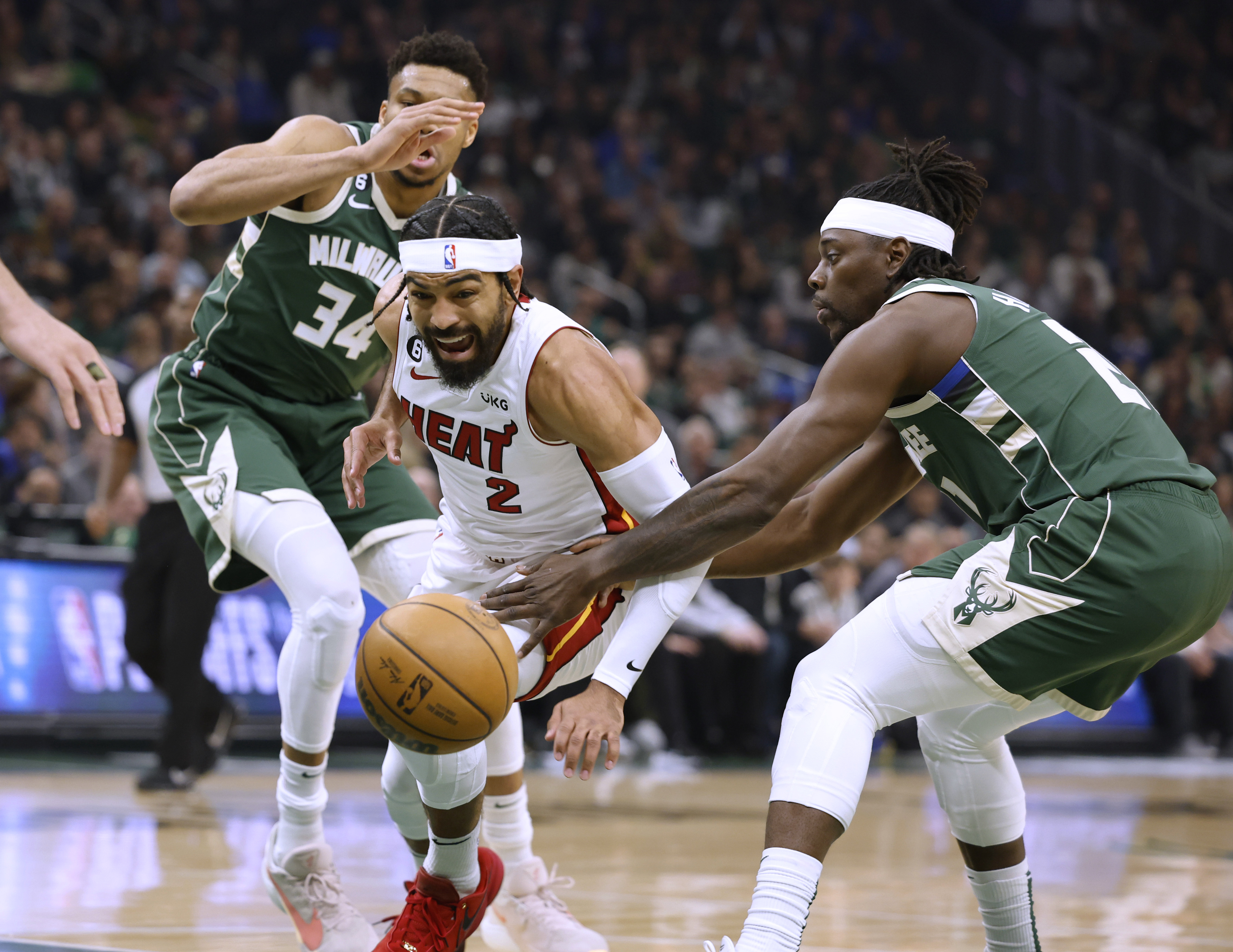 Heat rally again to win in OT, eliminate top-seeded Bucks