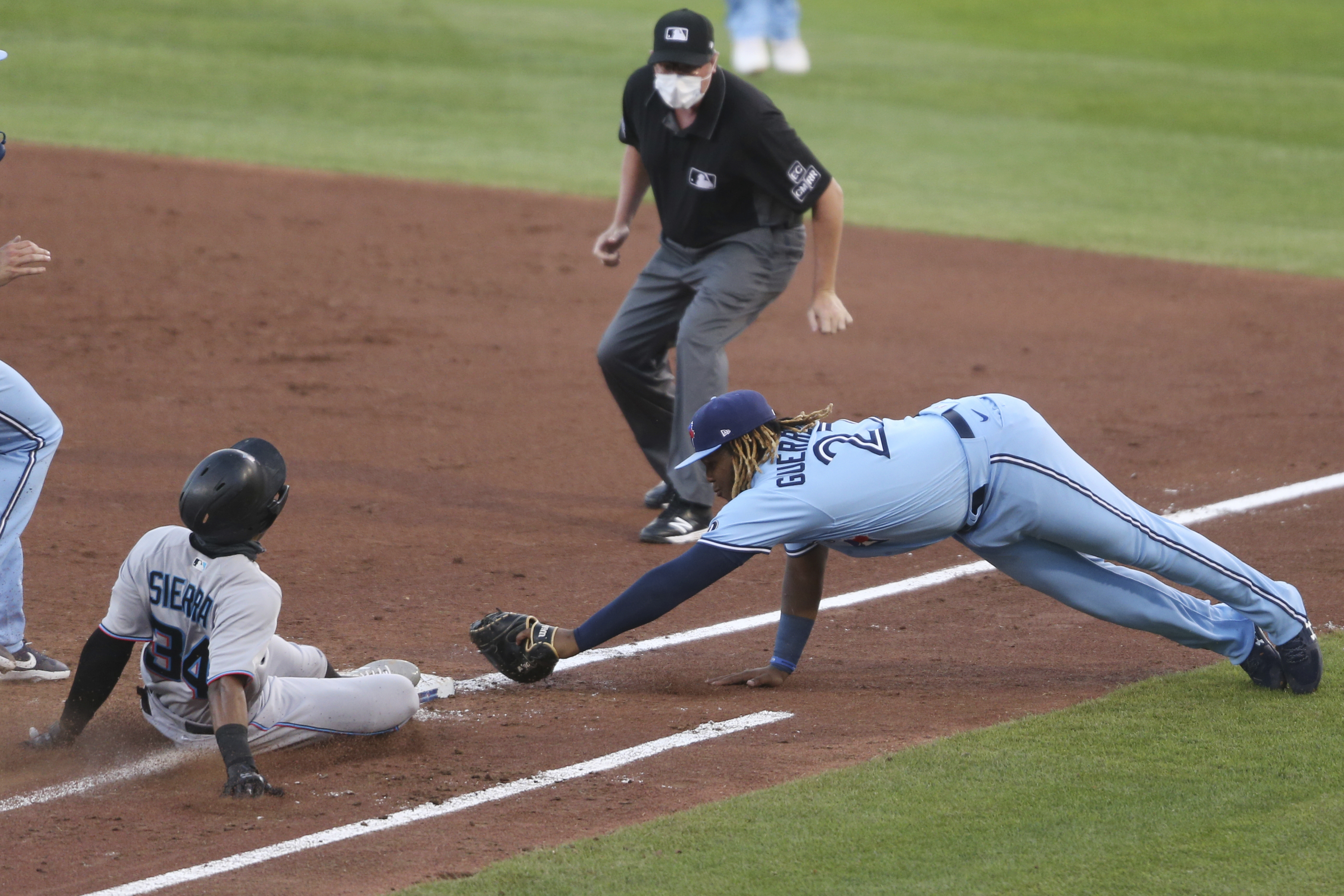 Marlins finally get to go home after beating Blue Jays 14-11