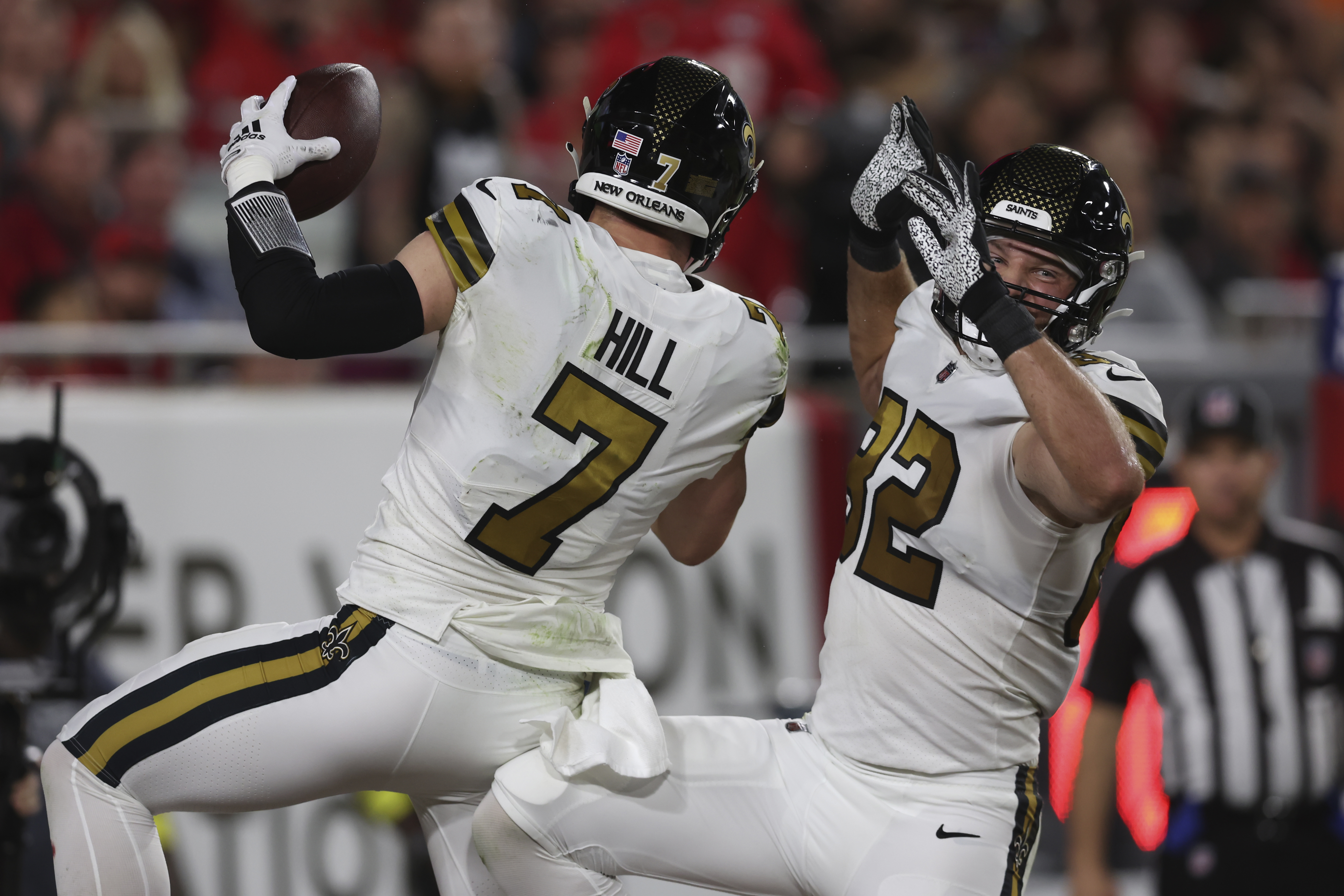 New Orleans Saints fans react to a replay call during the second half of an  NFL football game against the Jacksonville Jaguars, Sunday, Oct. 13, 2019,  in Jacksonville, Fla. (AP Photo/Stephen B.