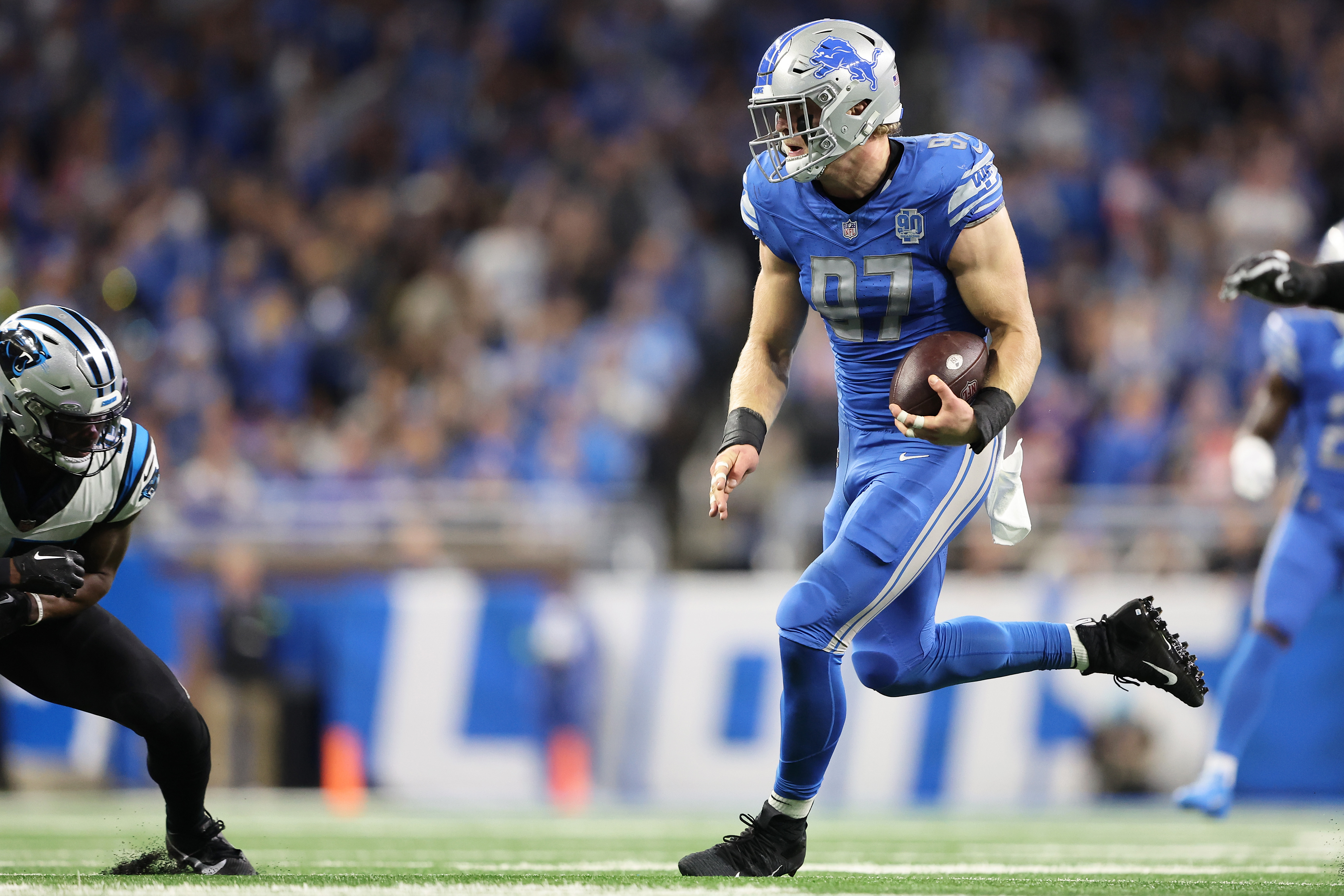 DETROIT, MI - NOVEMBER 06: Detroit Lions defensive end Aidan Hutchinson  (97) makes an interception in the end zone during the Detroit Lions versus  the Green Bay Packers game on Sunday November