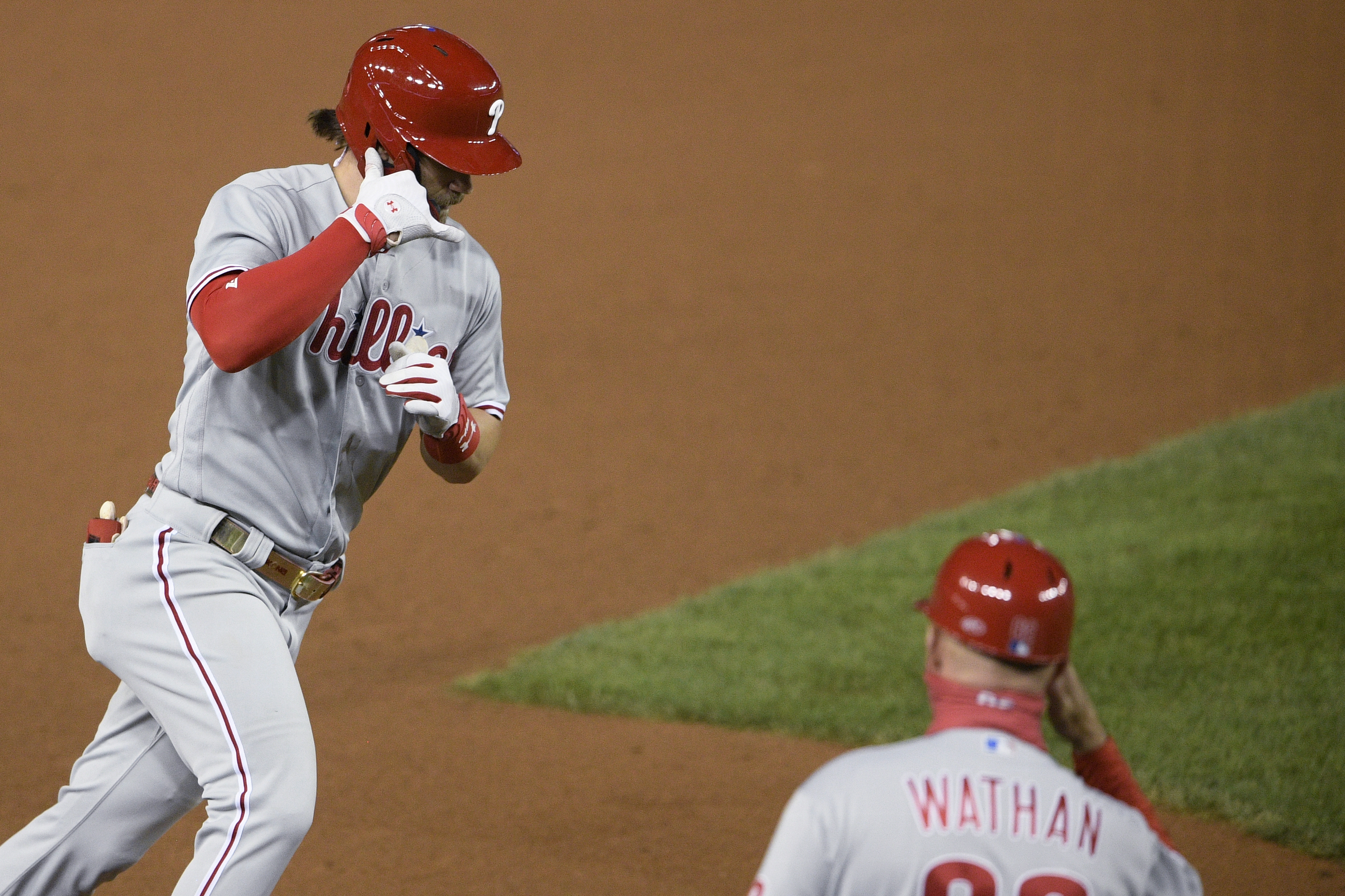 Philadelphia Phillies - Rhys Hoskins and Bryce Harper celebrating Hoskins'  solo home run.