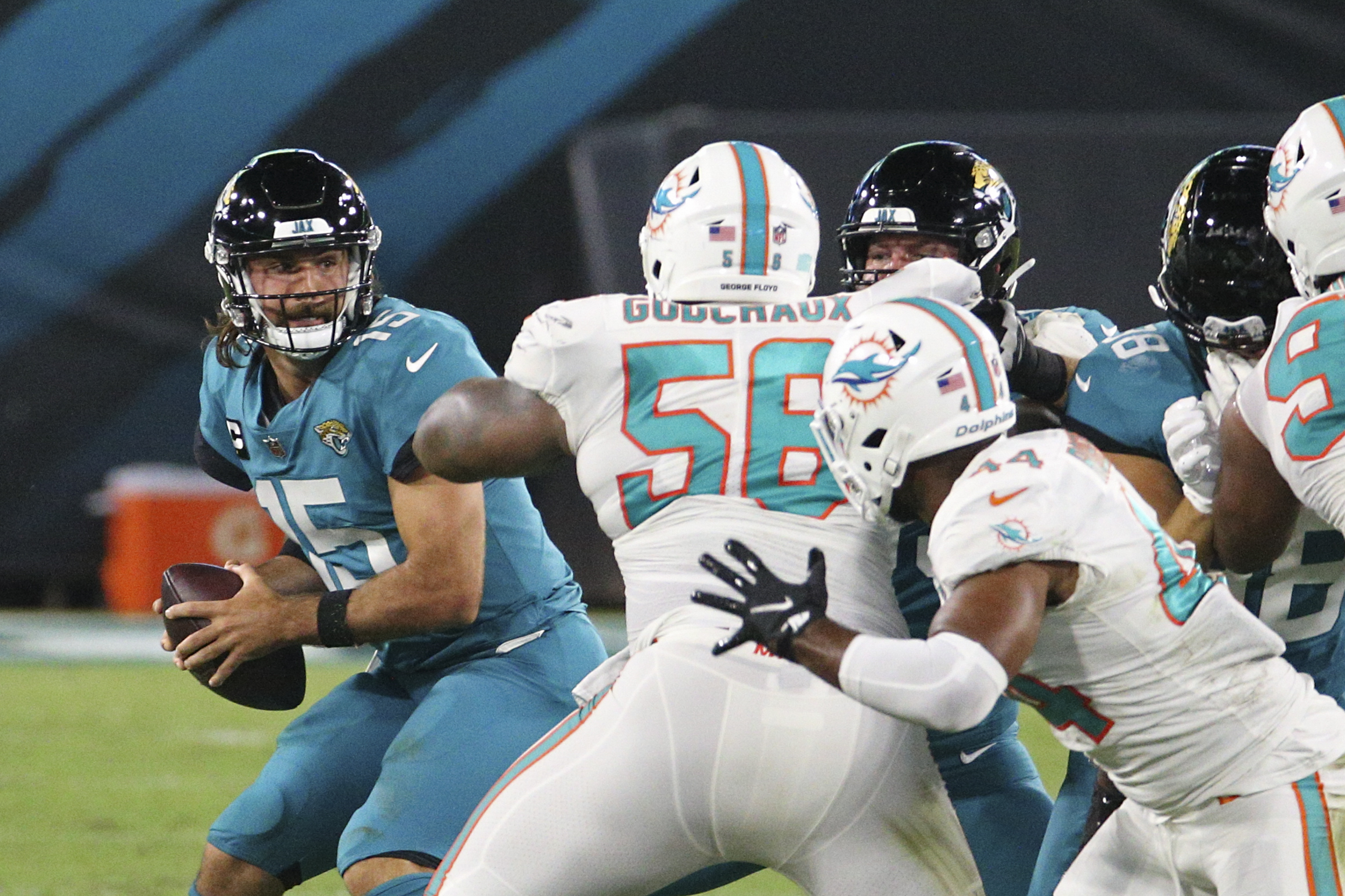 Miami Dolphins defensive tackle Davon Godchaux (56) reacts after