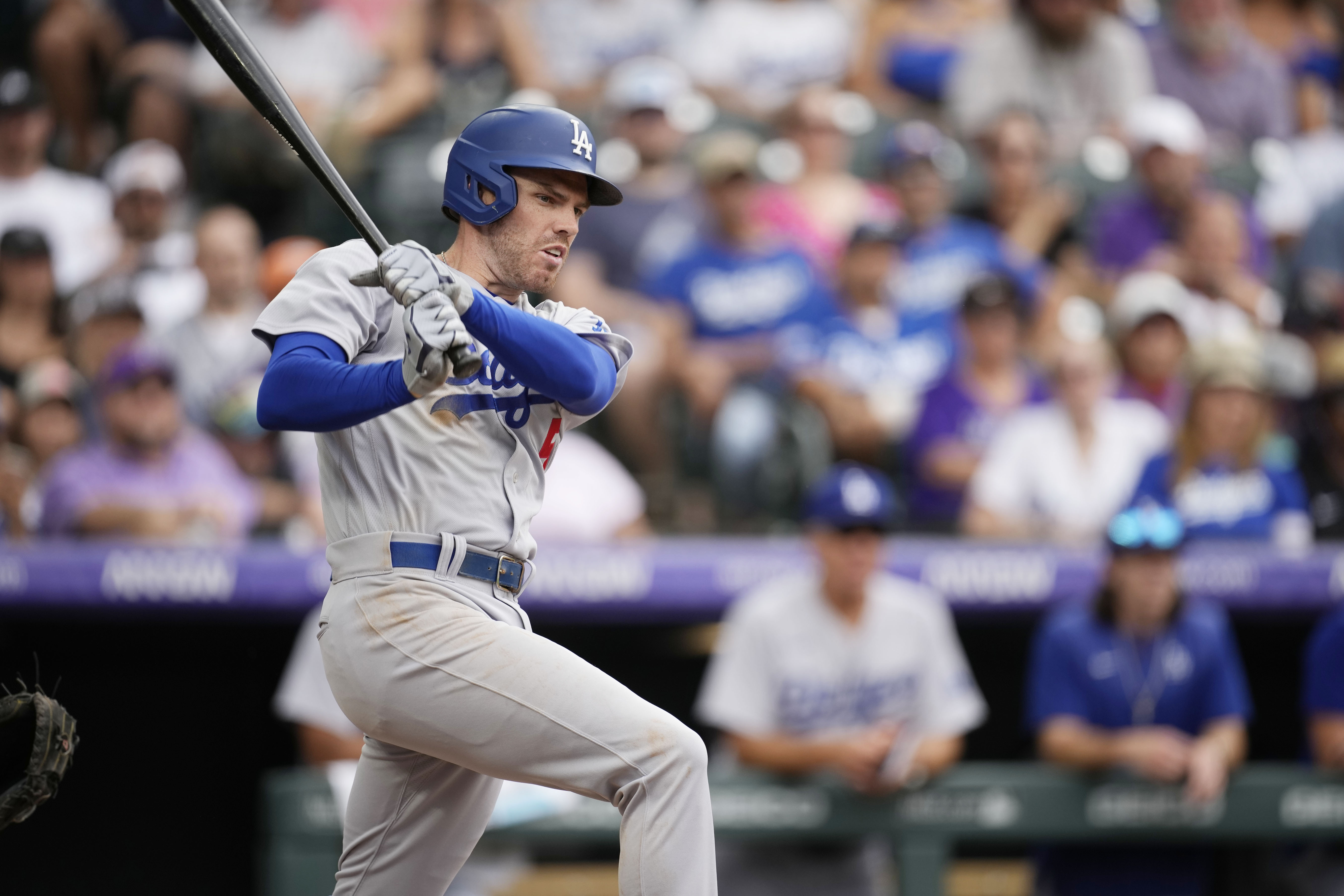 Kris Bryant hits one of the Rockies' four homers in a 7-3 win over