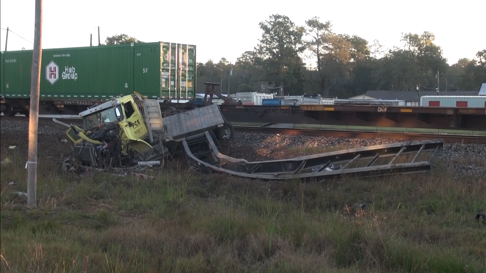 Driver narrowly escapes after train strikes 18-wheeler stuck on tracks in  Porter