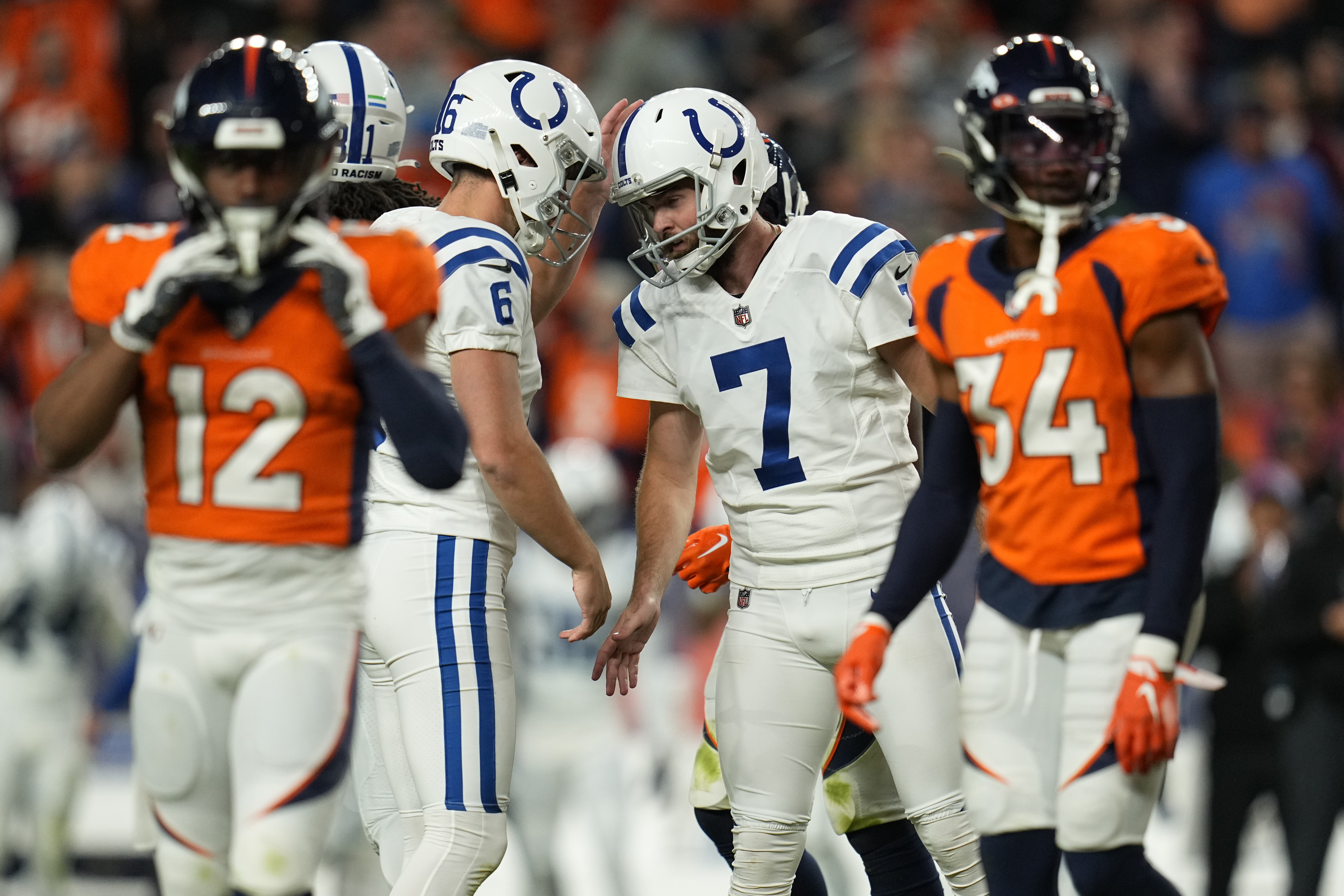 Denver Broncos linebacker Josey Jewell (47) can't make the catch as  Indianapolis Colts linebacker Zaire Franklin (44) pressures during the  second half of an NFL football game, Thursday, Oct. 6, 2022, in