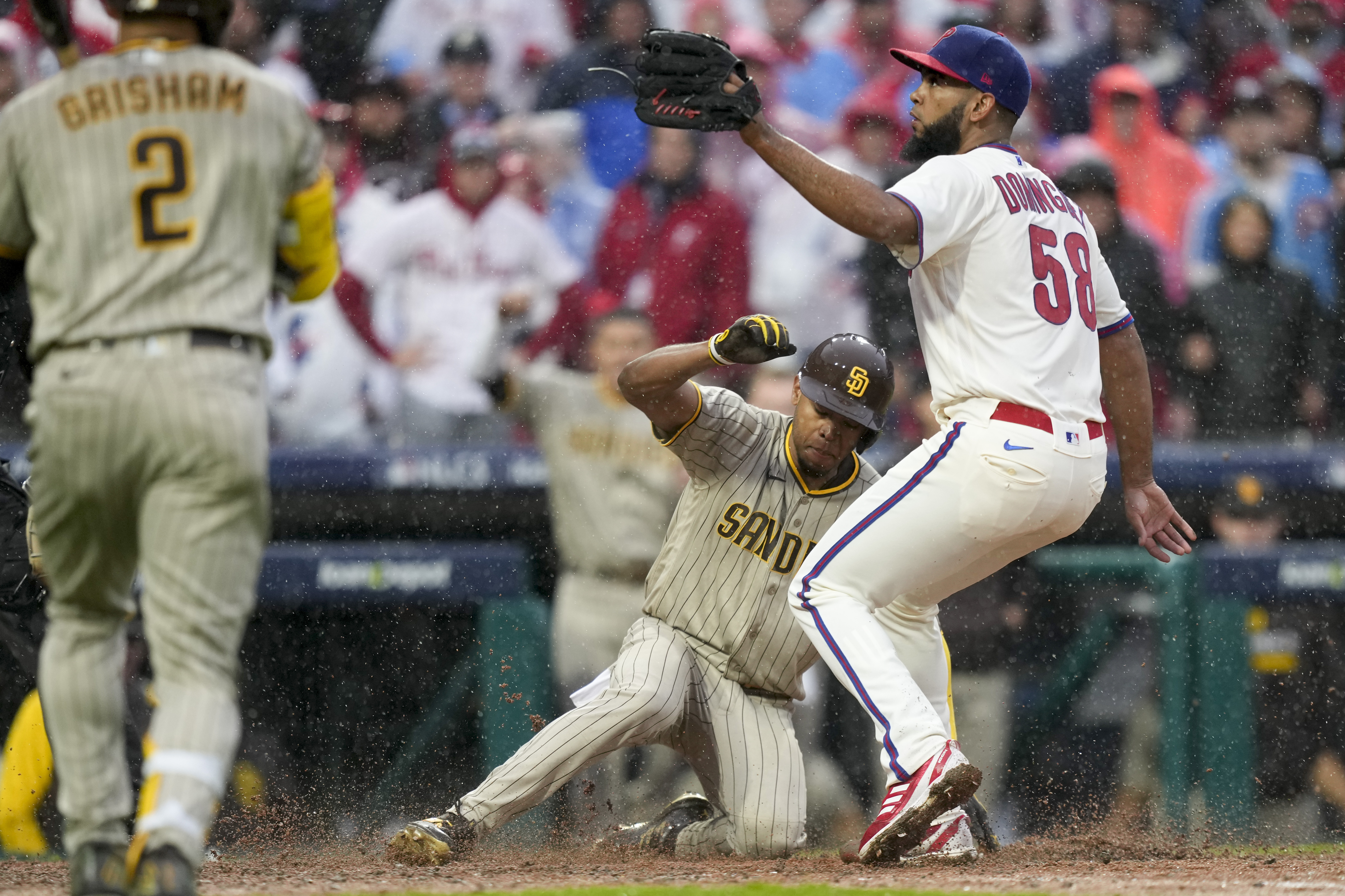 Philadelphia Phillies starting pitcher Ranger Suarez and catcher J.T.  Realmuto celebrate after winning the baseball NL Championship Series  against the San Diego Padres on Sunday, Oct. 23, 2022, in Philadelphia. (AP  Photo/Brynn