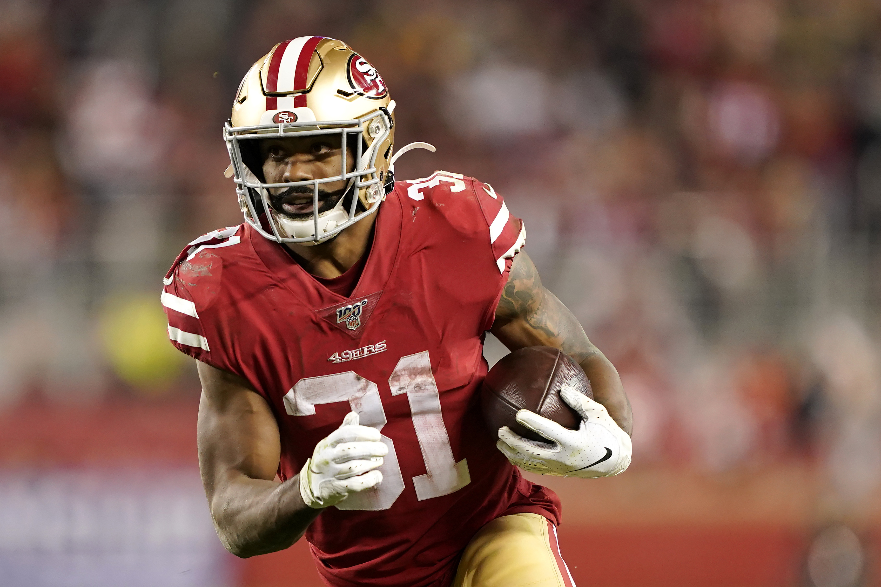 Miami Dolphins running back Raheem Mostert (31) runs with the ball in the  third quarter during an NFL football game against the San Francisco 49ers,  Sunday, Dec. 04, 2022 in Santa Clara