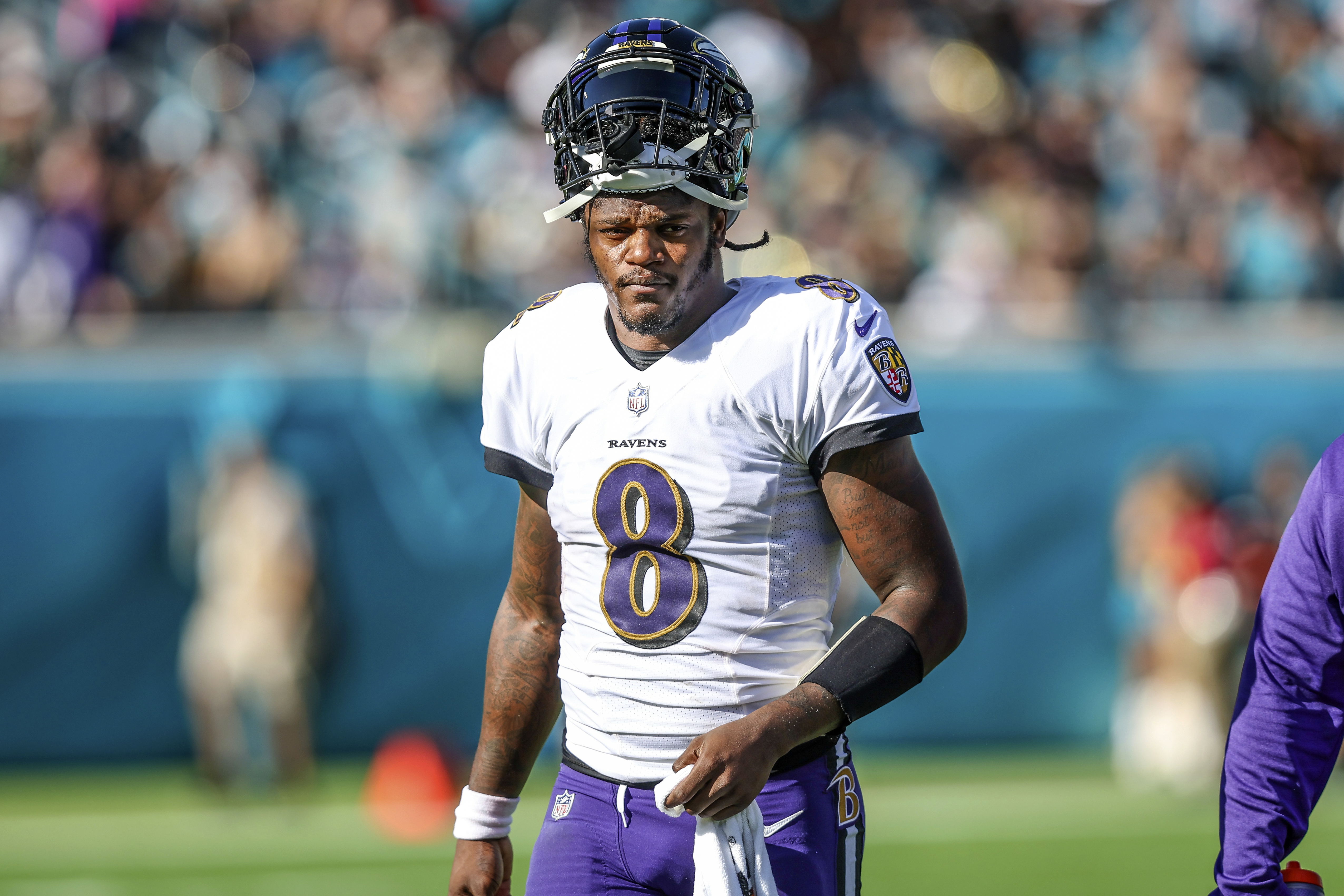 Lamar Jackson of the Baltimore Ravens scrambles against the Houston