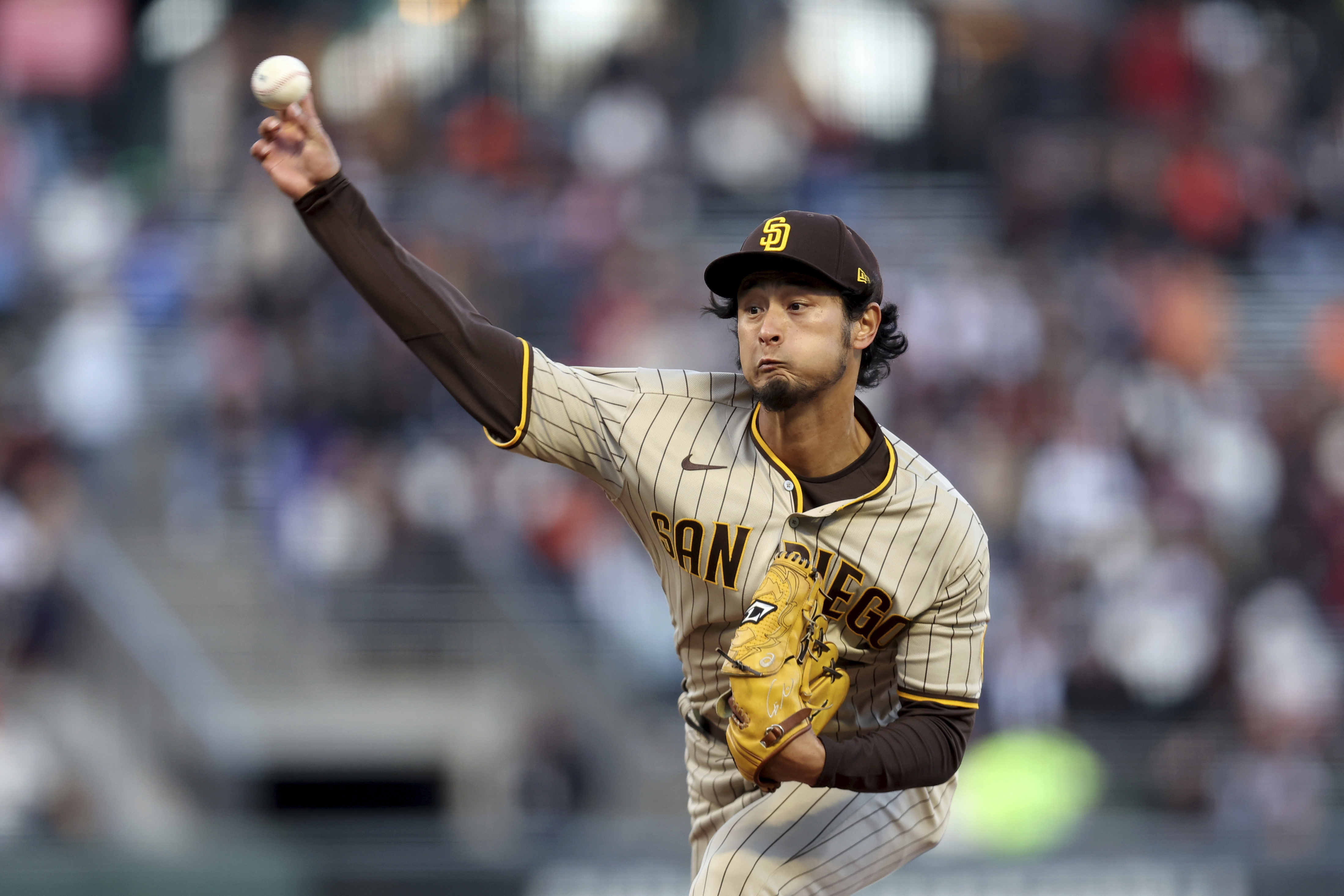 San Francisco Giants' Logan Webb wears a hat and shirt for first baseman  Brandon Belt before a baseball game between the Giants and the Arizona  Diamondbacks in San Francisco, Wednesday, Sept. 29