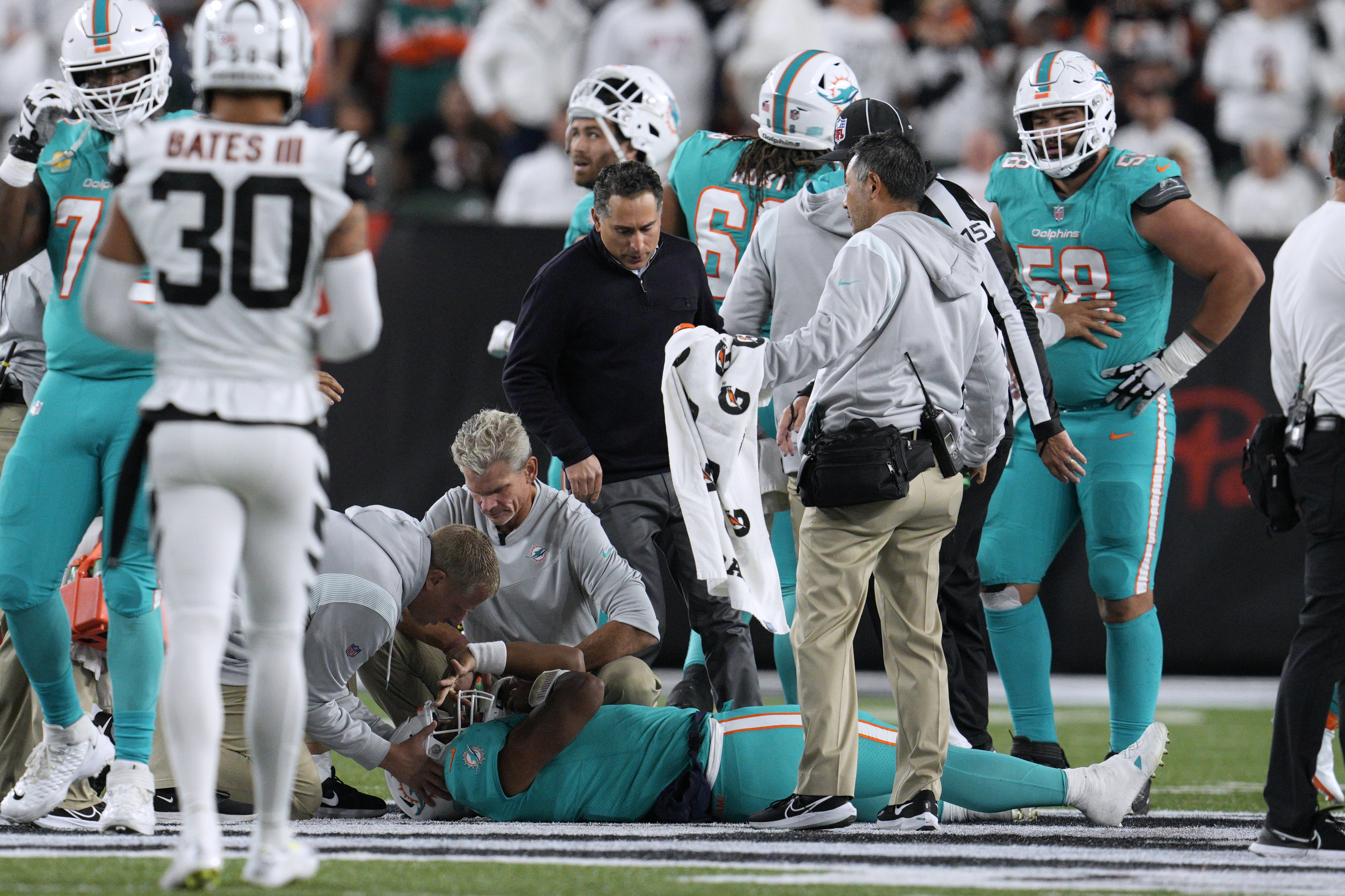 Miami Dolphins offensive tackle Terron Armstead (72) grabs quarterback Tua  Tagovailoa (1) after he was hit on a play during the first half of an NFL  football game against the Buffalo Bills