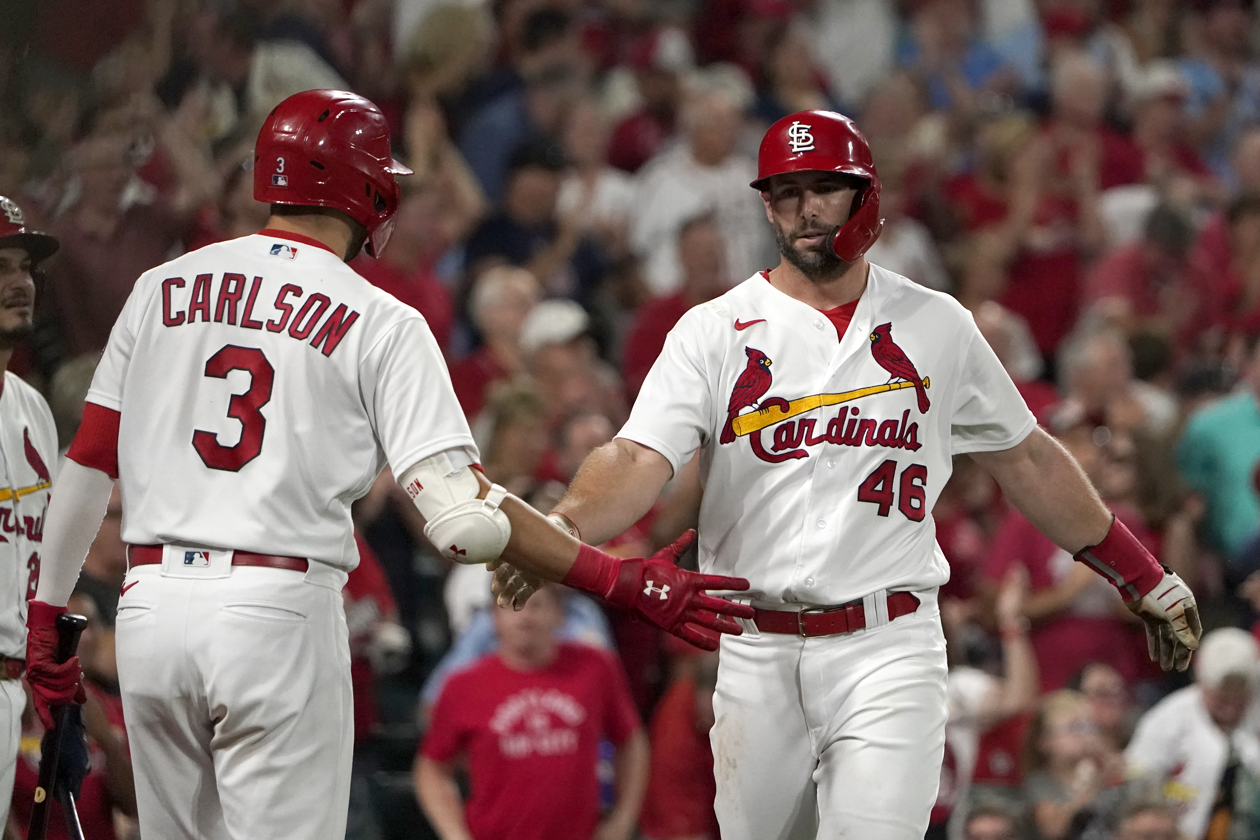 St. Louis Cardinals' Dylan Carlson is congratulated by teammates after  hitting a two-run home run during the fifth inning of the team's baseball  game against the Chicago Cubs on Tuesday, Aug. 2