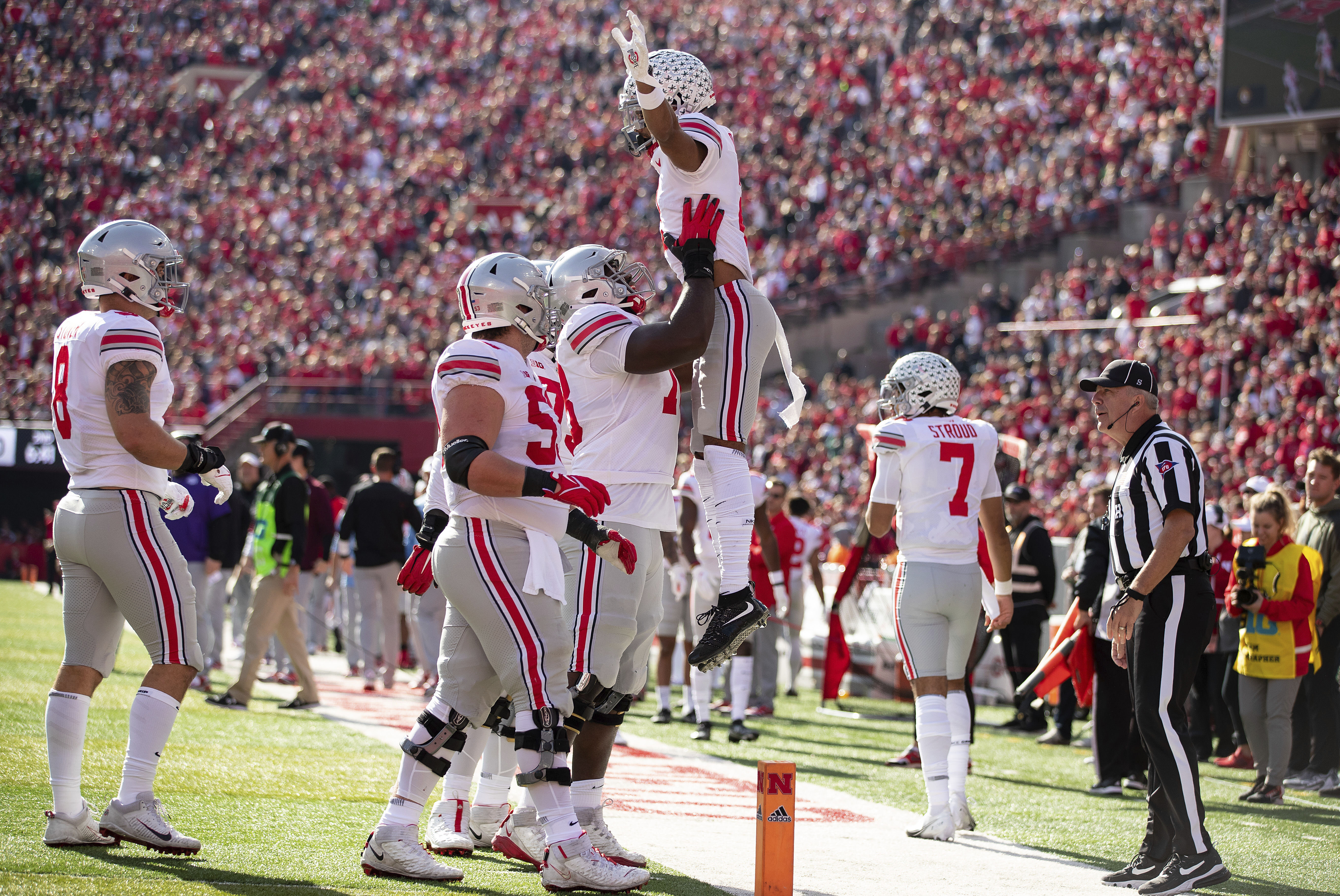 Chris Olave of the Ohio State Buckeyes celebrates after a