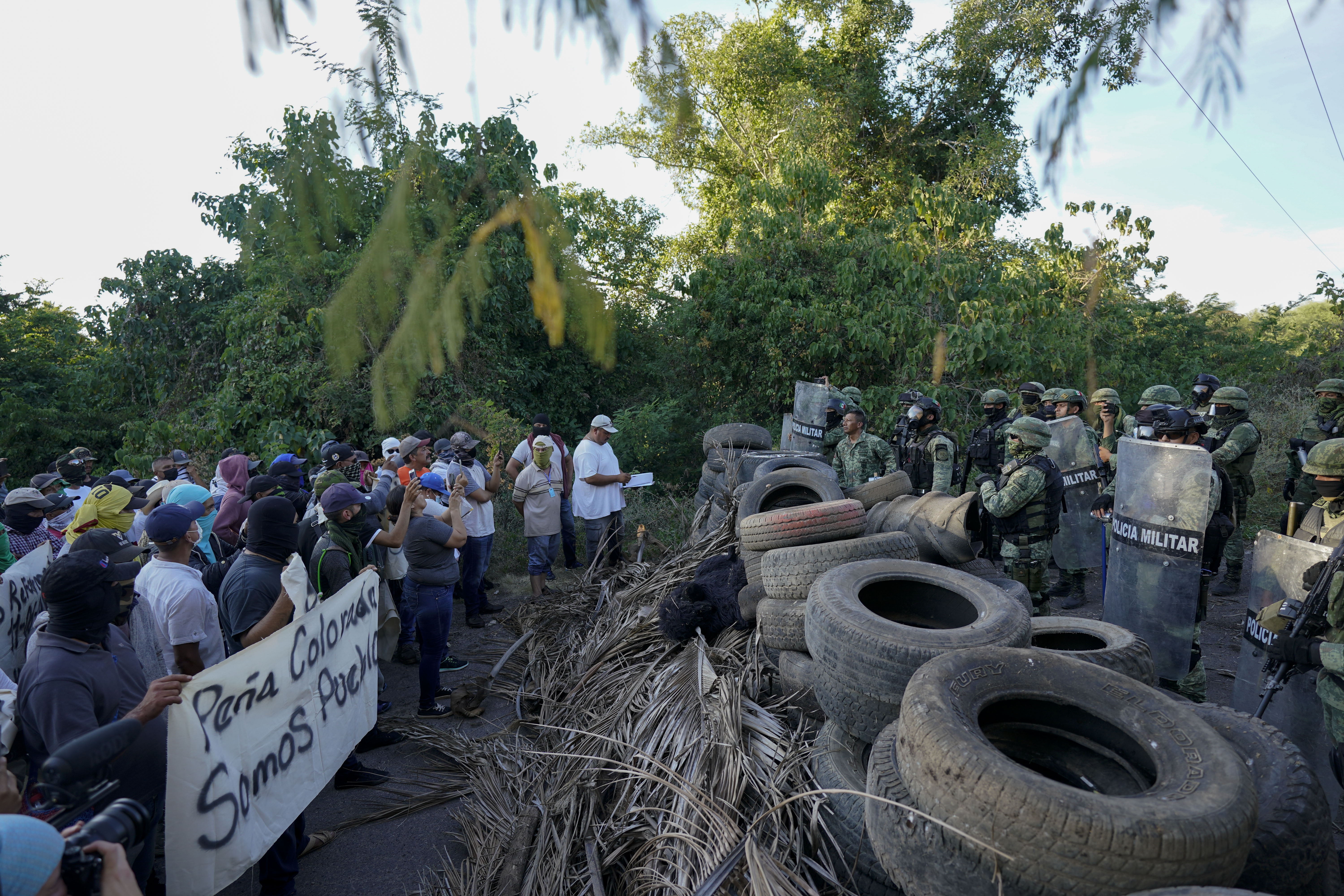 Mexico's drug war uses drones, human shields, gunships