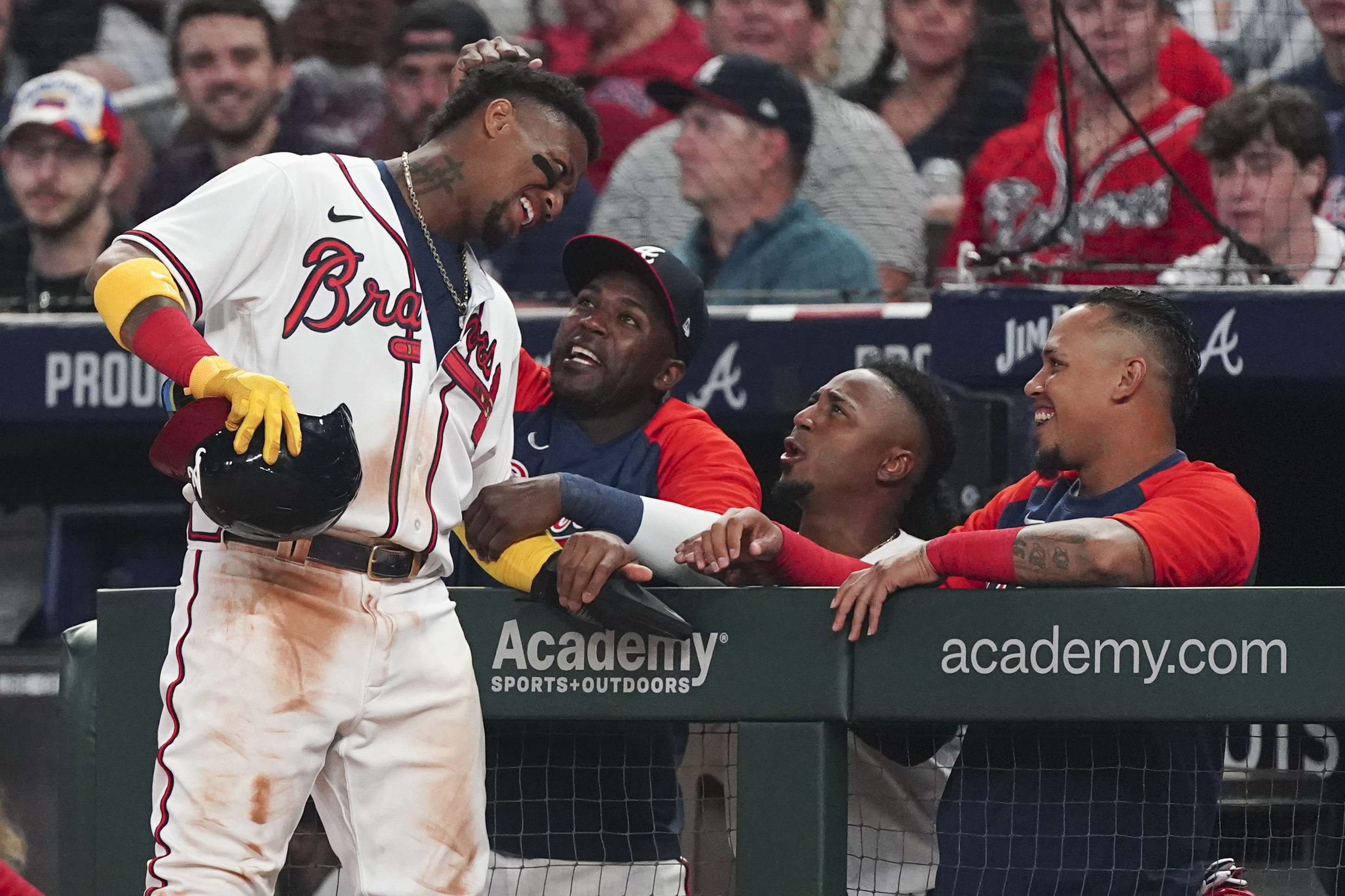 Ozzie Albies and Dansby Swanson of the Atlanta Braves react at the