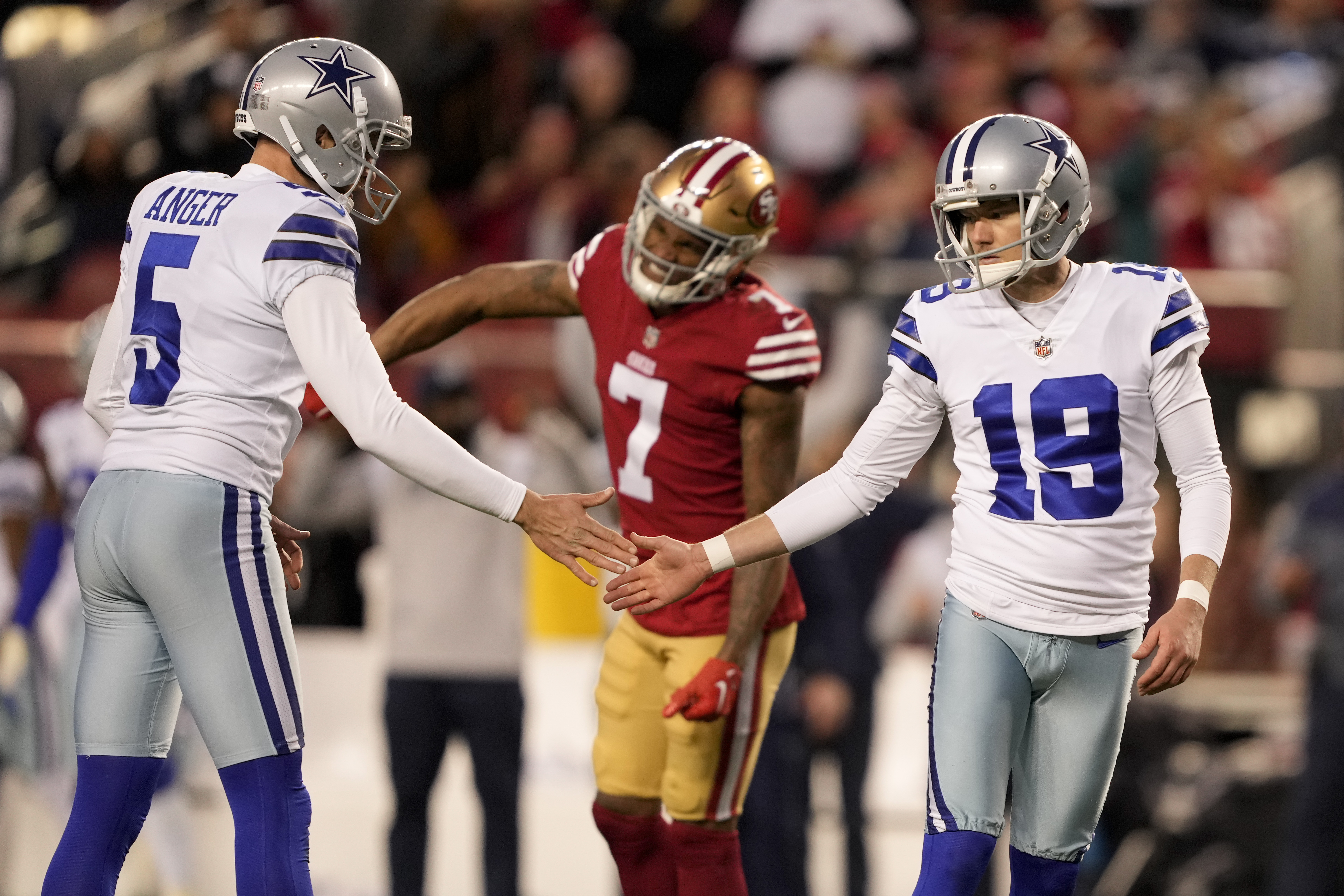 Dallas Cowboys linebacker Micah Parsons (11) and wide receiver CeeDee Lamb  (88) walk off the field after the first half of an NFL divisional round  playoff football game against the San Francisco