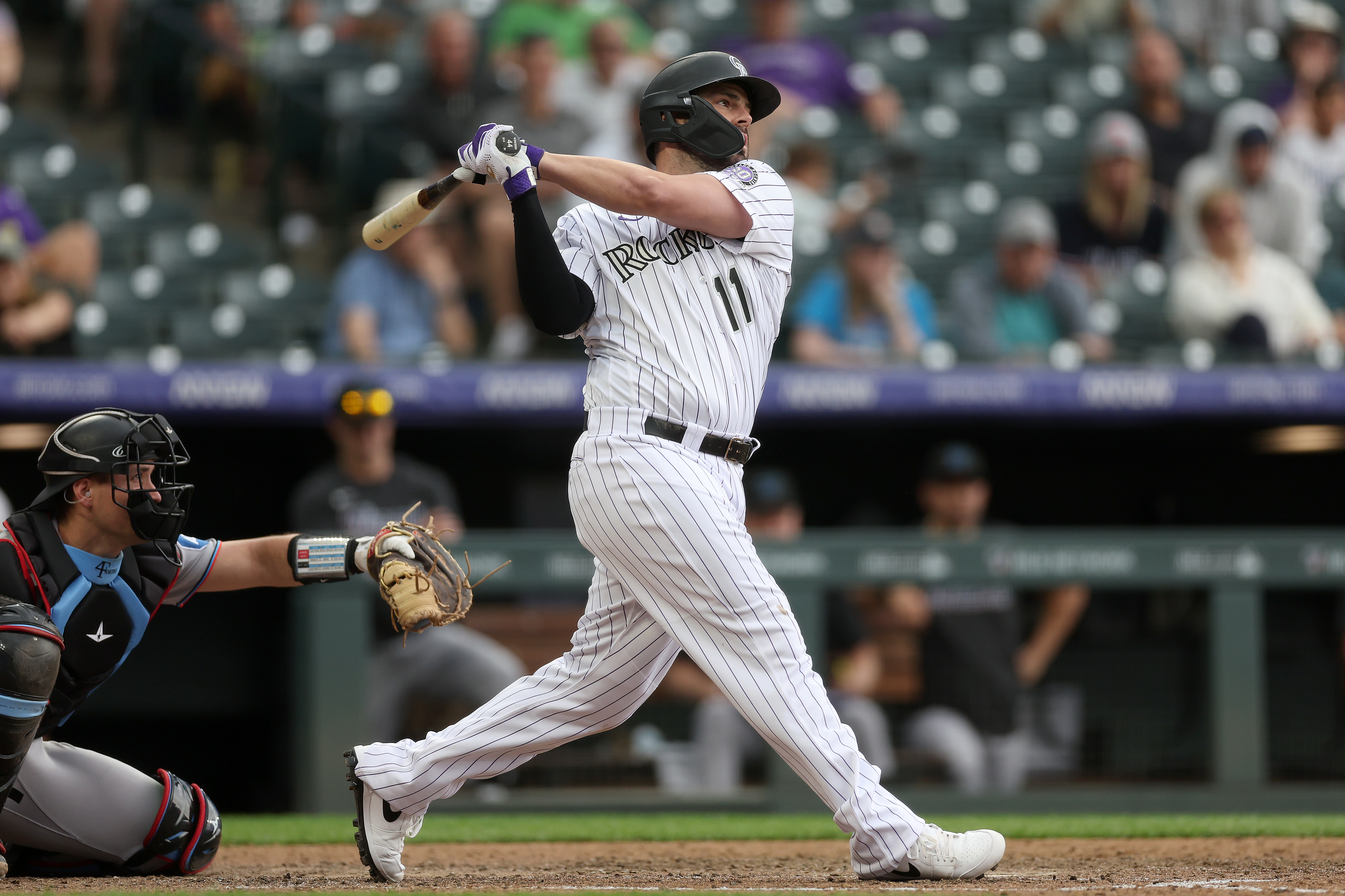 Tovar's single in storm lifts Rockies over Marlins 7-6 after blown