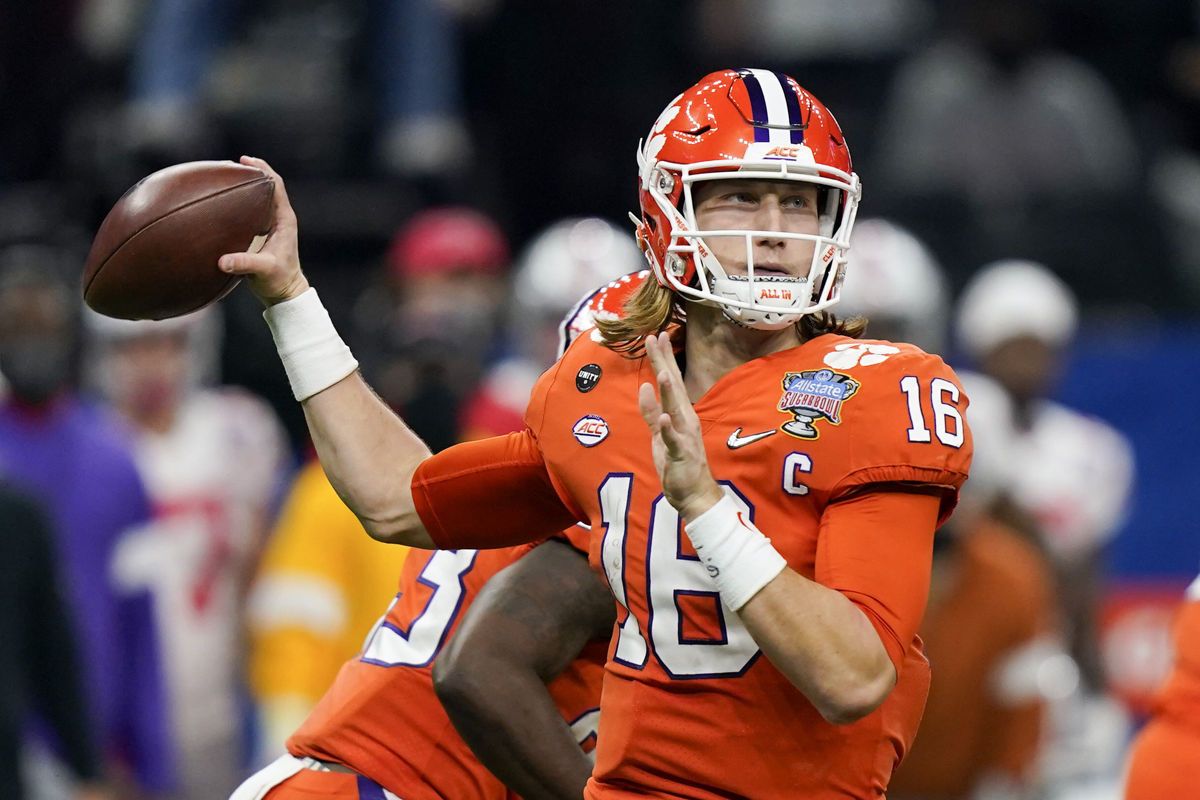 Clemson's Trevor Lawrence (16) prepares to throw the ball with