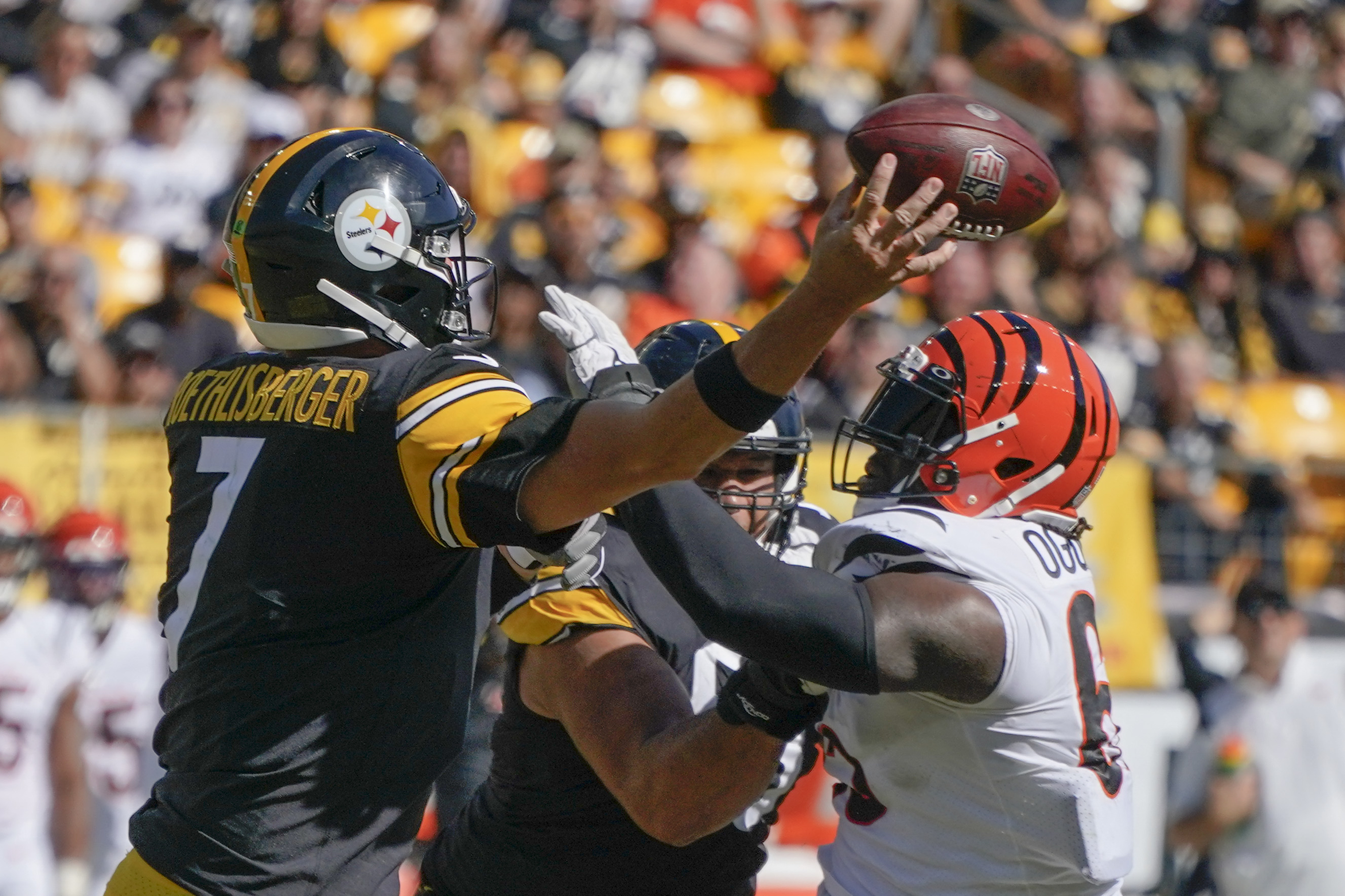 Cincinnati Bengals Michael Johnson holds on the jersey and sacks Pittsburgh  Steelers quarterback Ben Roethlisberger for a lost of eight yards in the  second quarter at Heinz Field in Pittsburgh, Pennsylvania on