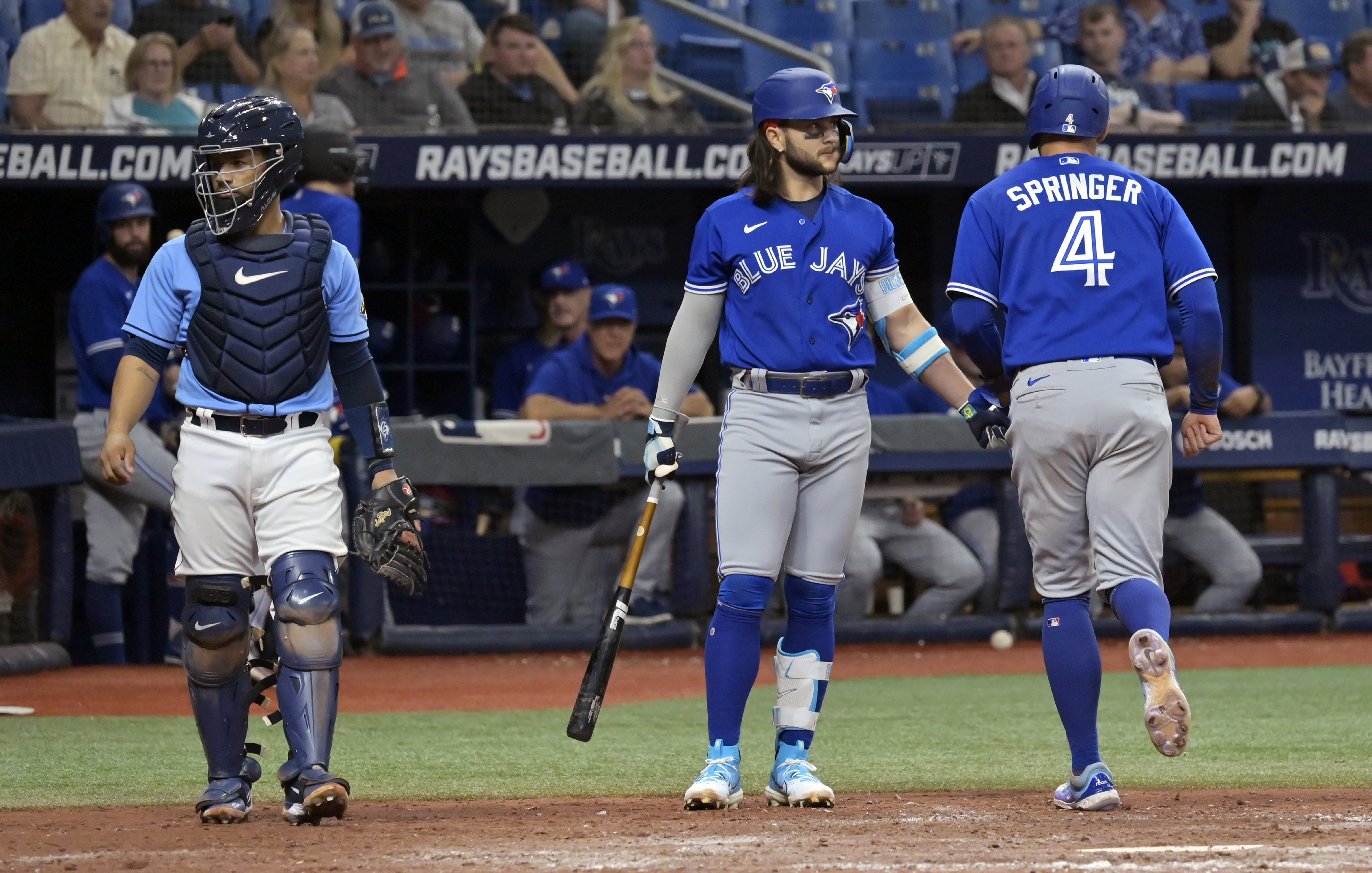 Blue Jays' George Springer carted off after colliding with Bo Bichette