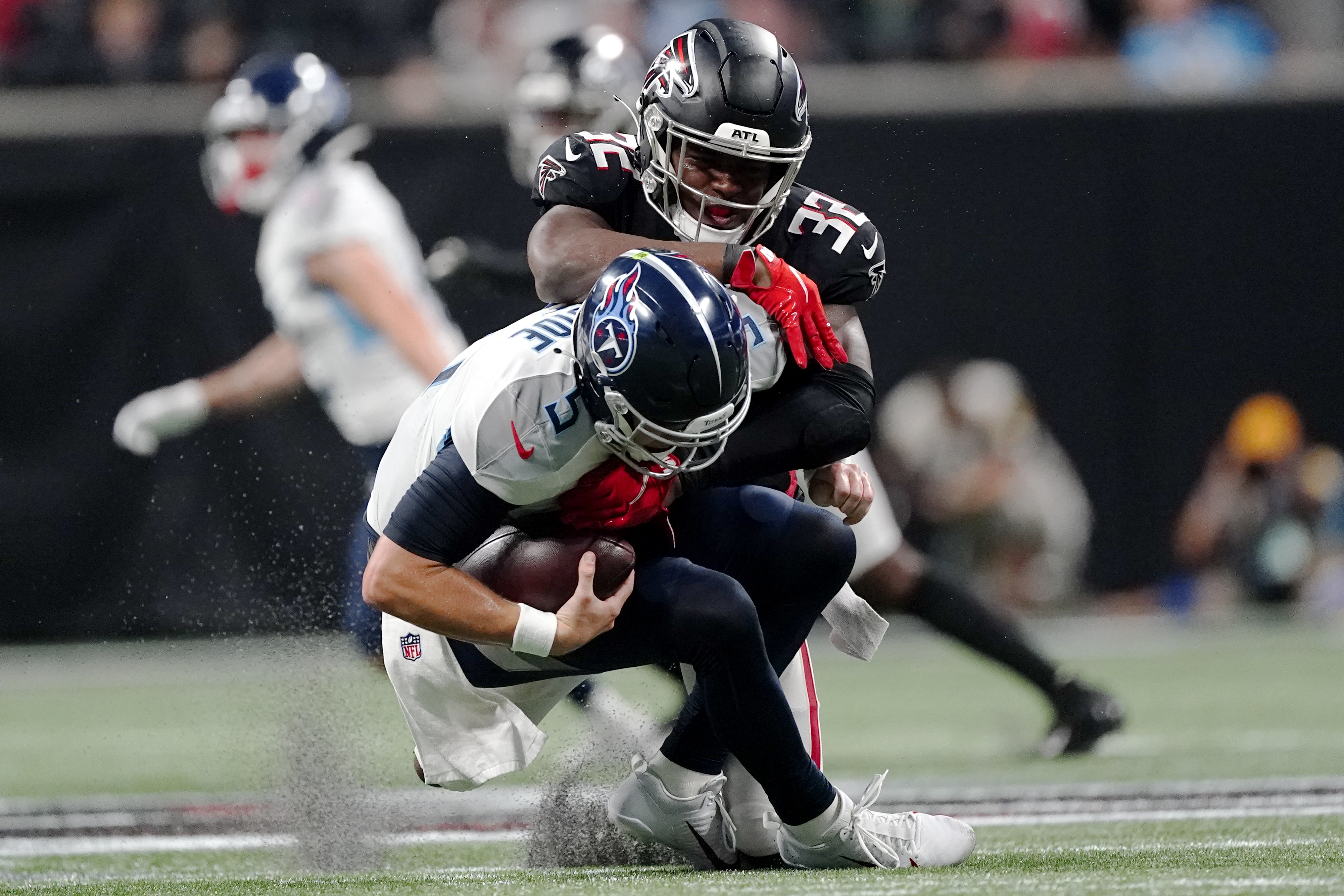 Atlanta Falcons quarterback Logan Woodside (11) calls the count at