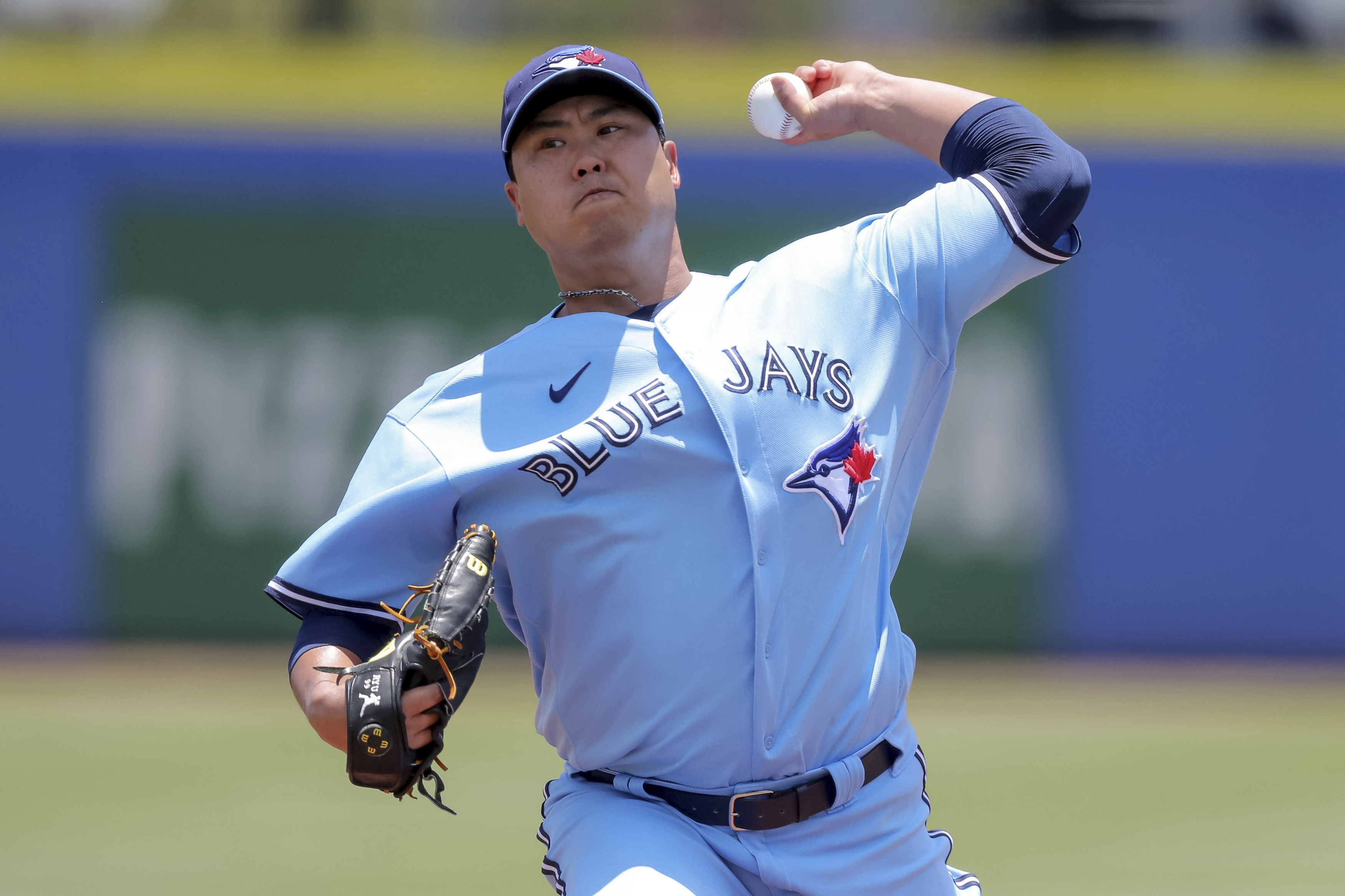 Toronto Blue Jays catcher Danny Jansen (9) gives a forearm bump to