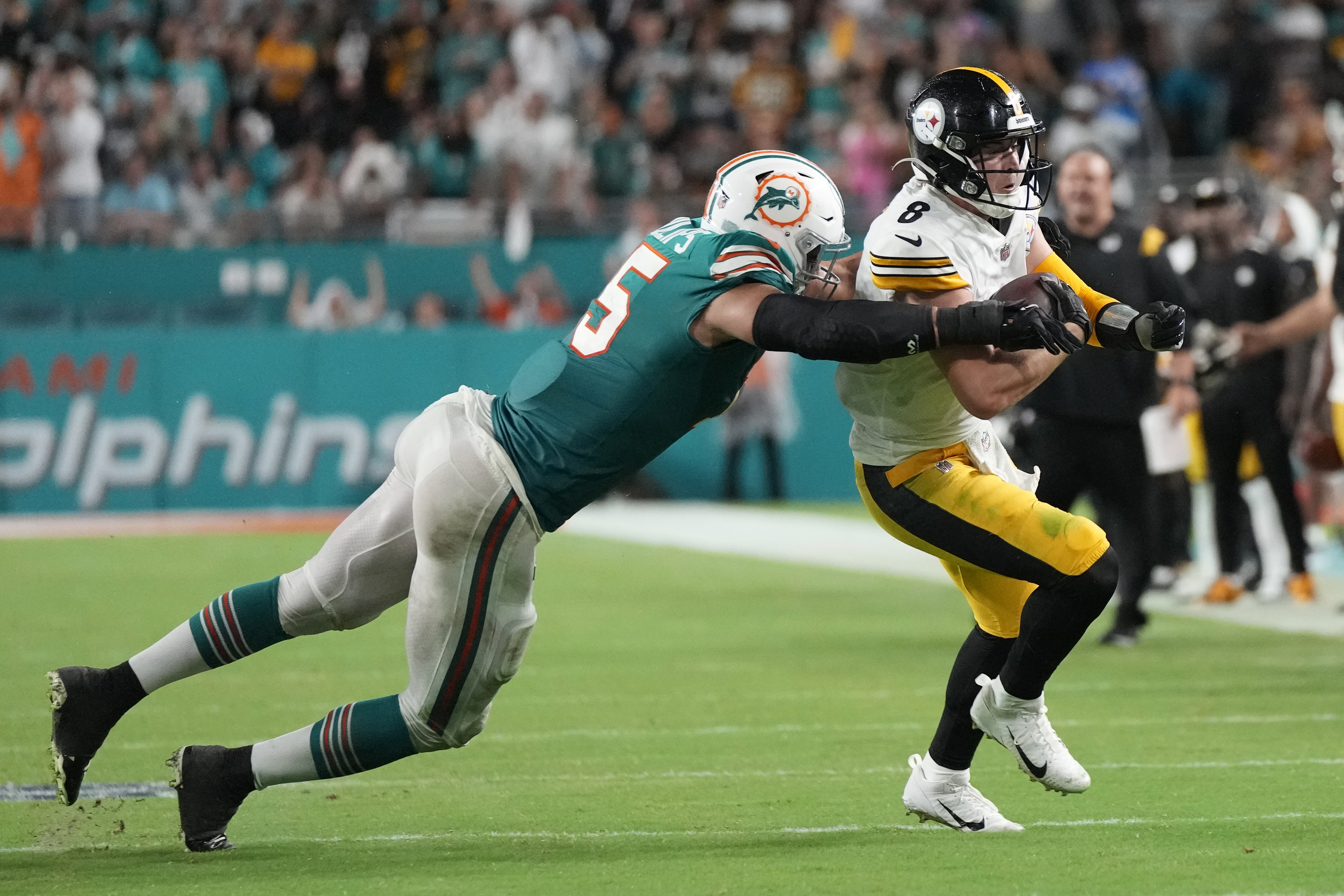 Miami Dolphins safety Brandon Jones (29) eyes the quarterback as he drops  back in coverage during an NFL football game against the Buffalo Bills,  Sunday, Sept. 25, 2022 in Miami Gardens, Fla.