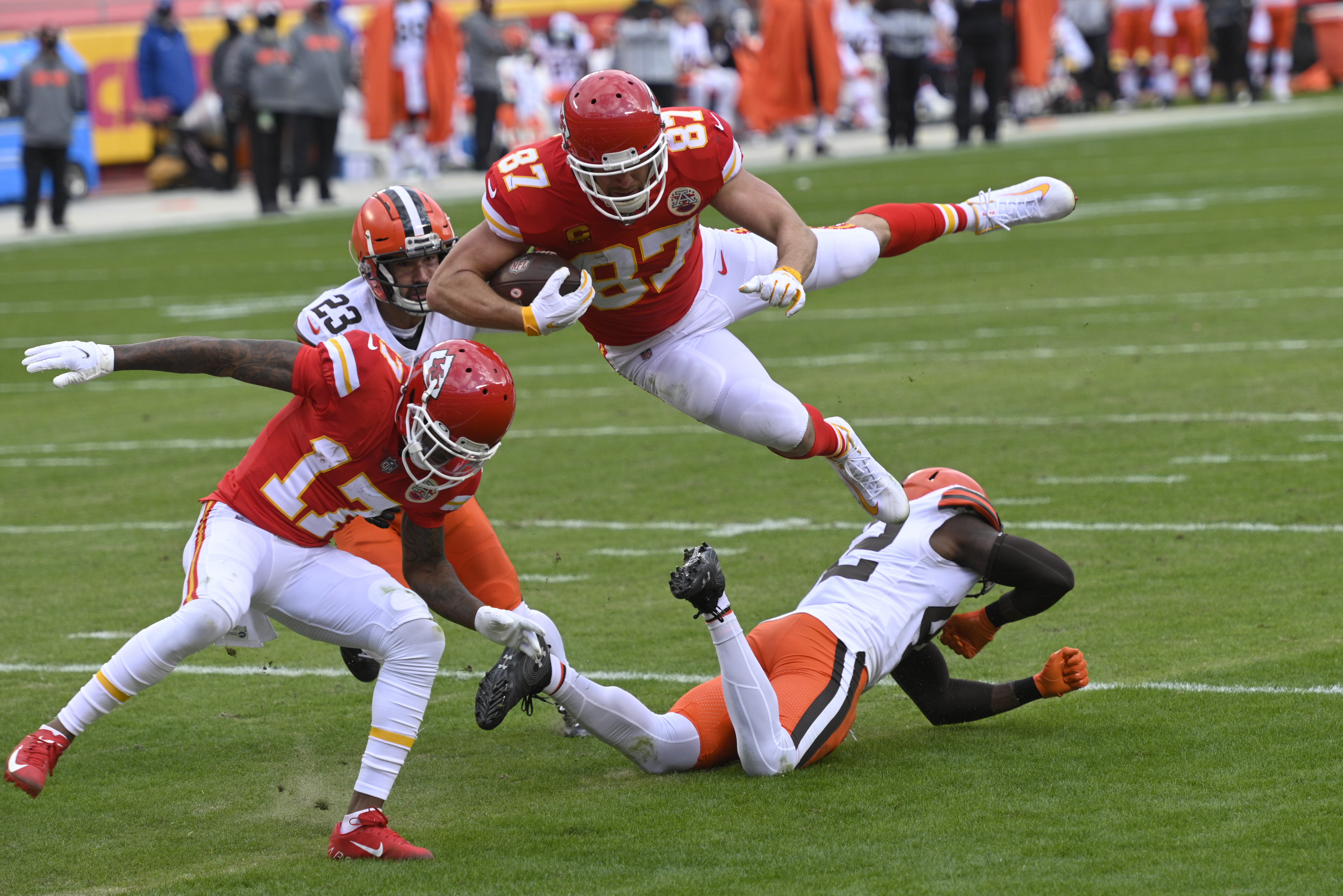 Kansas City Chiefs offensive coordinator Eric Bieniemy talks to Chiefs  tight end Travis Kelce (87) after their win over the Buffalo Bills in an  NFL divisional playoff football game, Sunday, Jan. 23