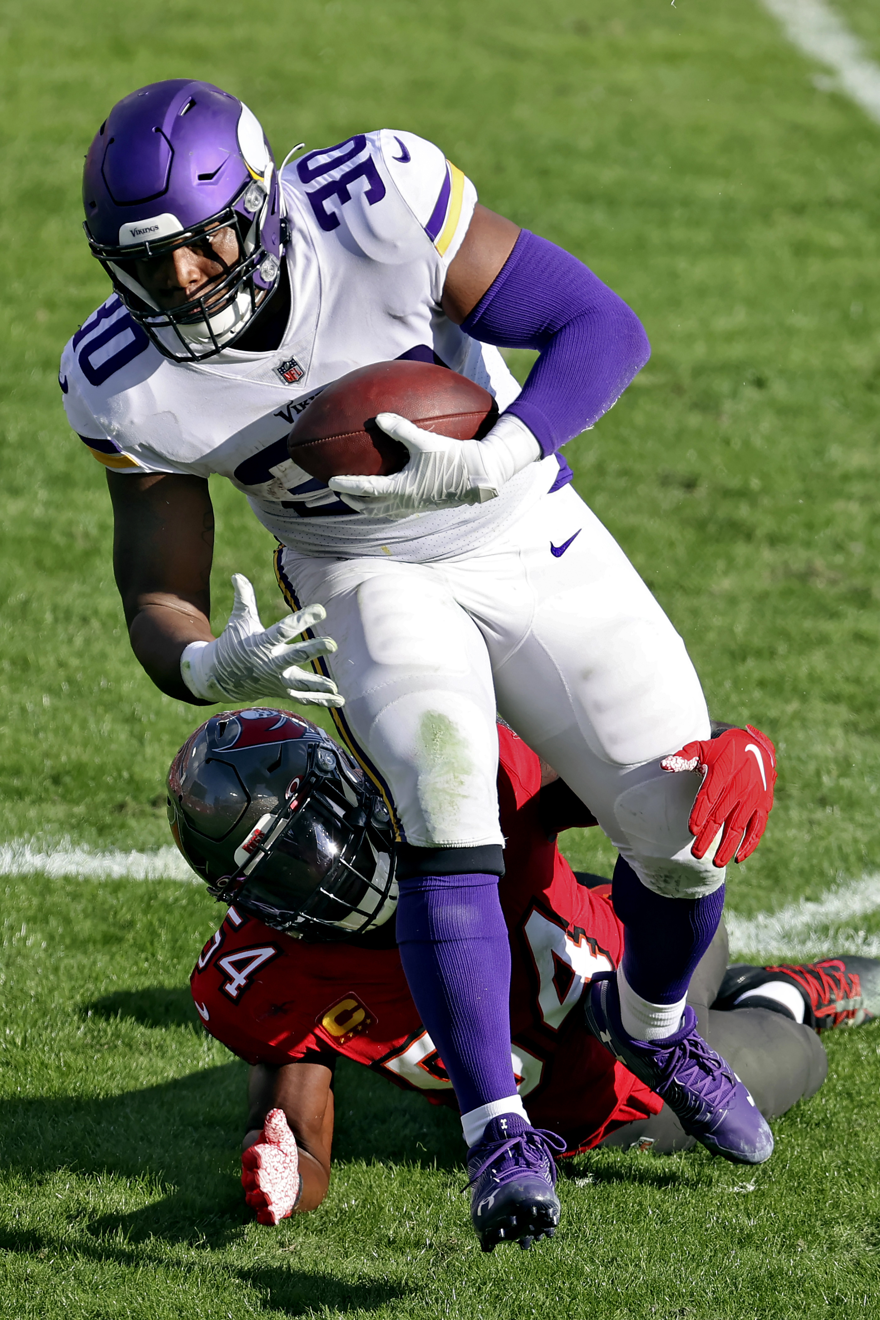 Minnesota Vikings fullback C.J. Ham (30) celebrates after his touchdown  with offensive tackle Brian O'Neill, right, in the second half of an NFL  football game against the Buffalo Bills, Sunday, Nov. 13