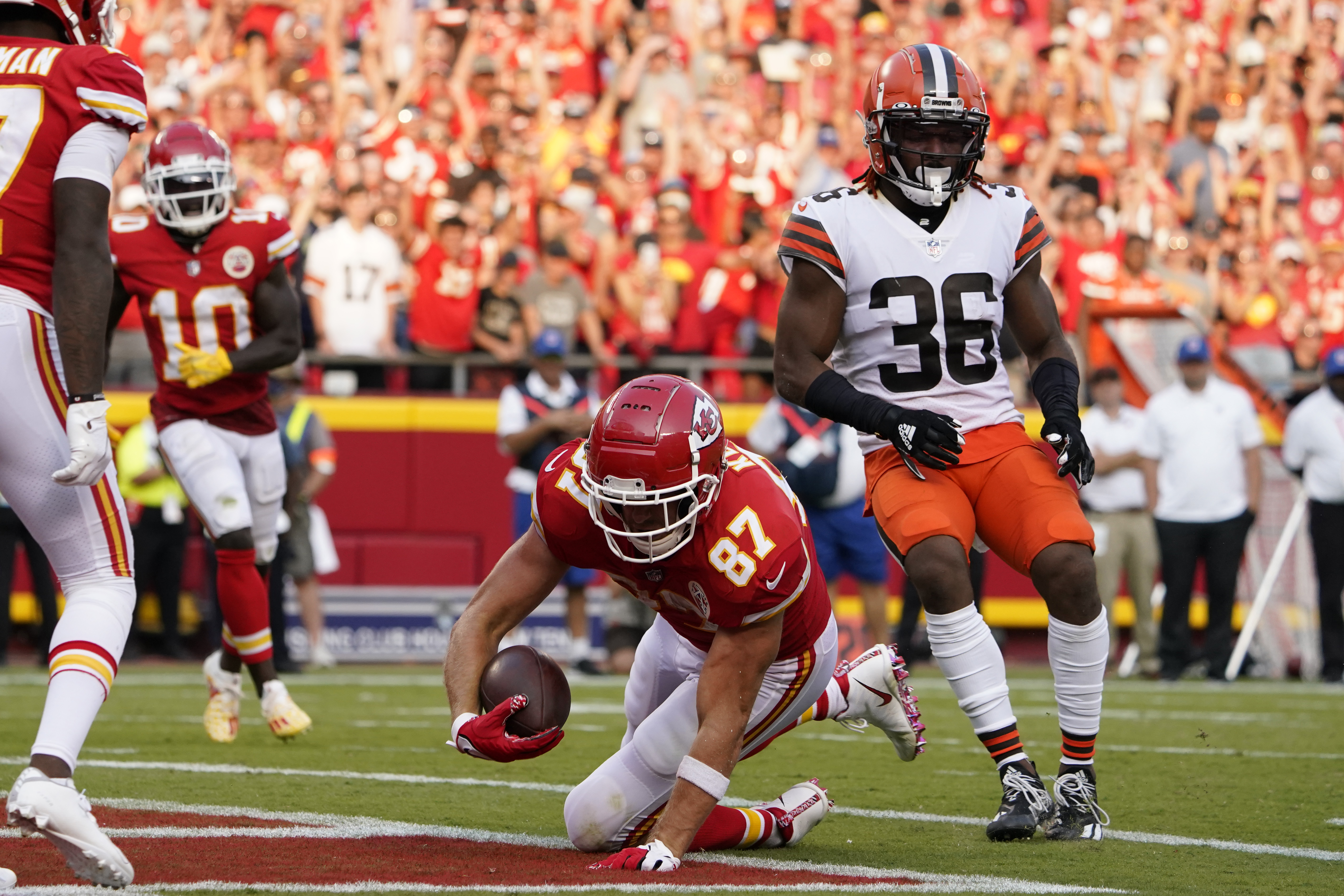 Kansas City Chiefs quarterback Patrick Mahomes (15) celebrates with tight  end Travis Kelce (87) after throwing a 67-yard touchdown pass to Tyreek  Hill during the first quarter of an NFL football game