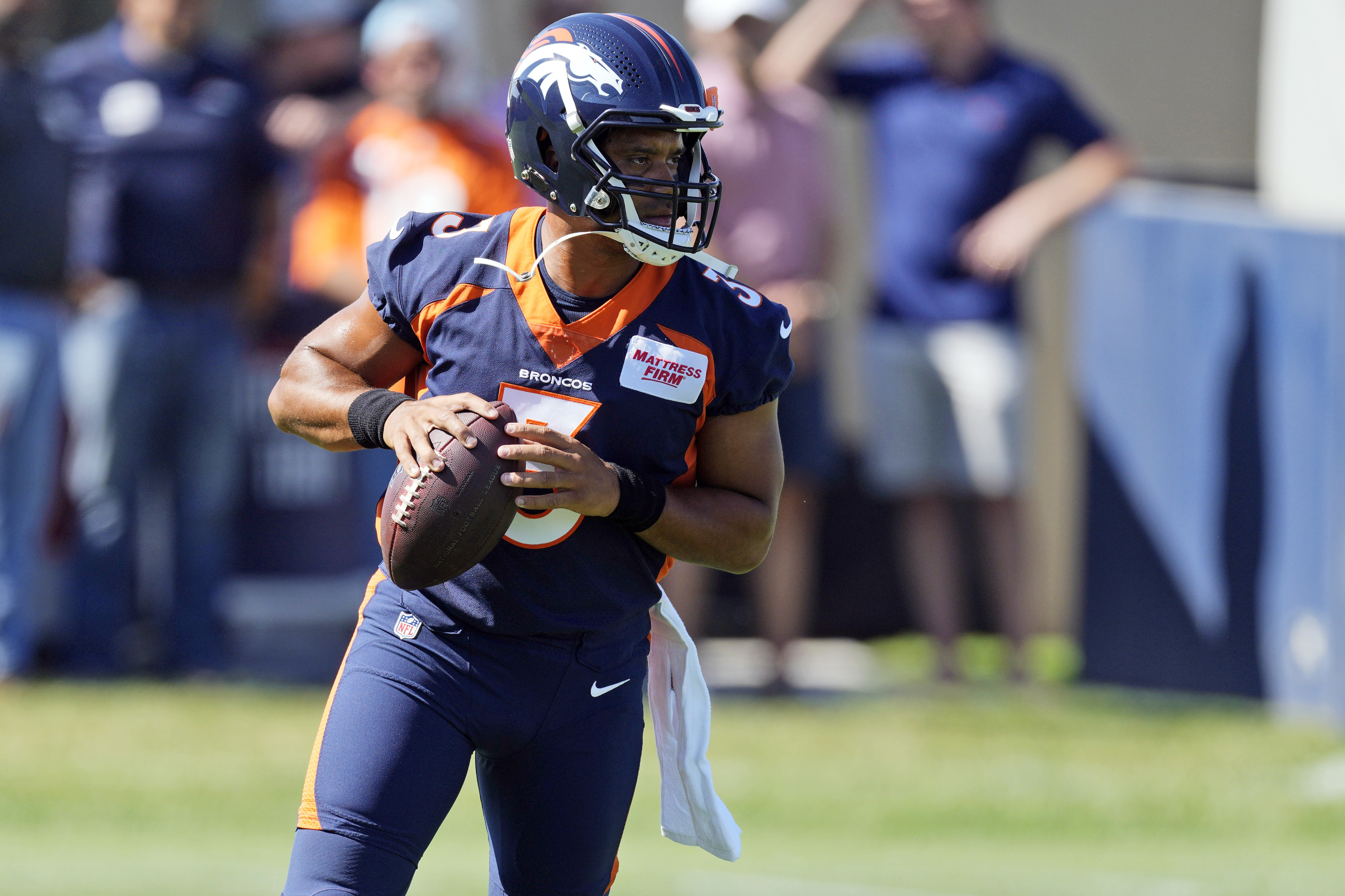 Russell Wilson performs under pressure during training camp