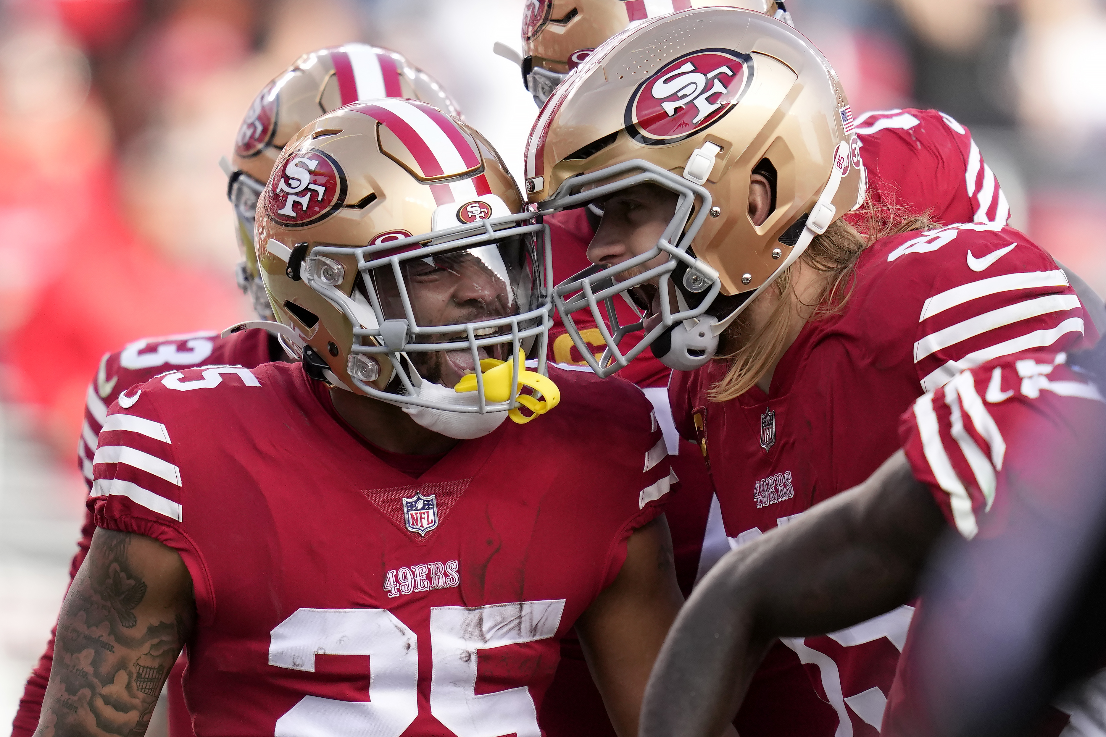 FILE - San Francisco 49ers tight end George Kittle (85) catches a touchdown  pass against the Arizona Cardinals during the first half of an NFL football  game in Santa Clara, Calif., Jan.