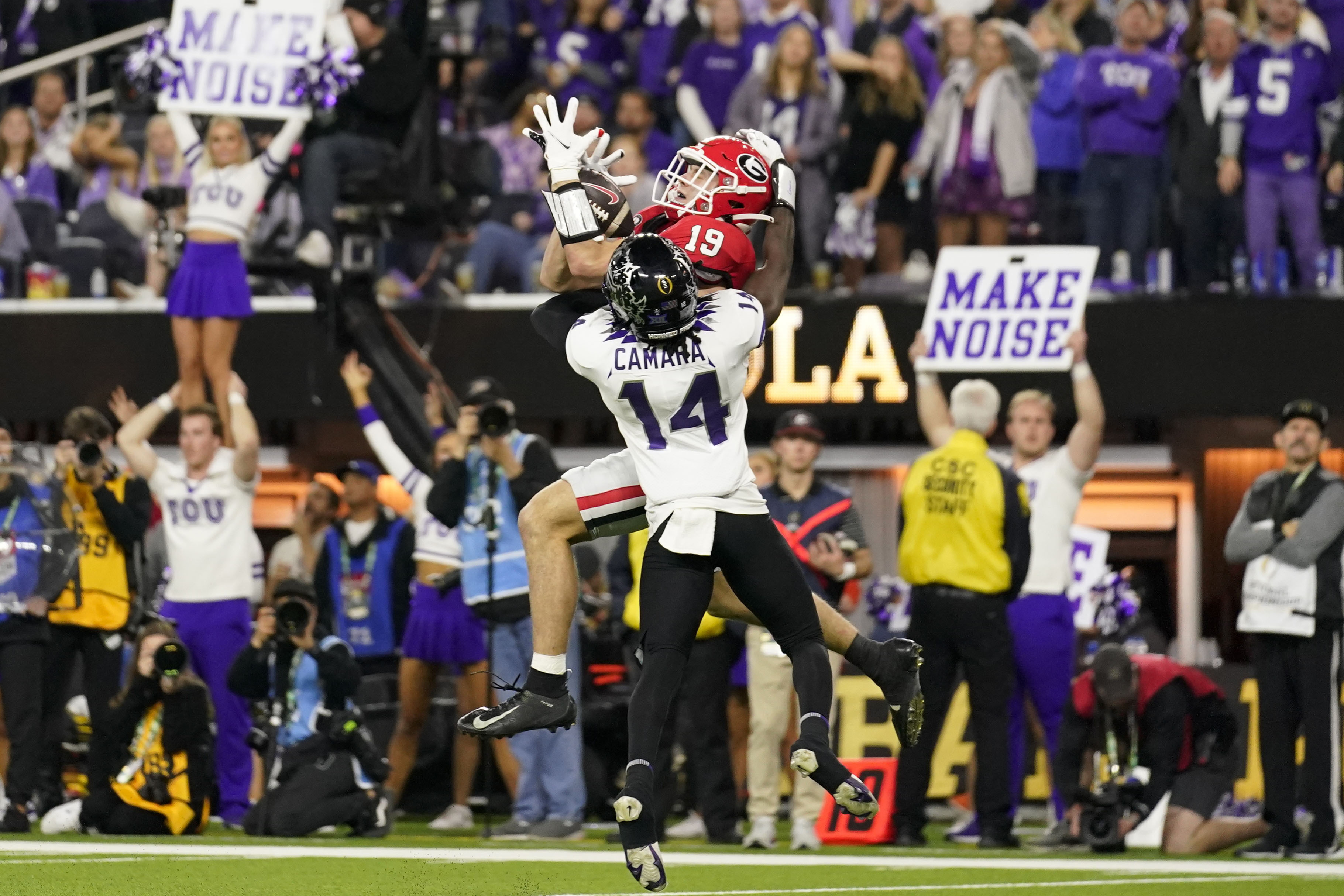 FILE - Georgia tight end Brock Bowers (19) makes a touchdown catch over TCU  safety Abraham Camara (14) during the second half of the national  championship NCAA College Football Playoff game, Monday