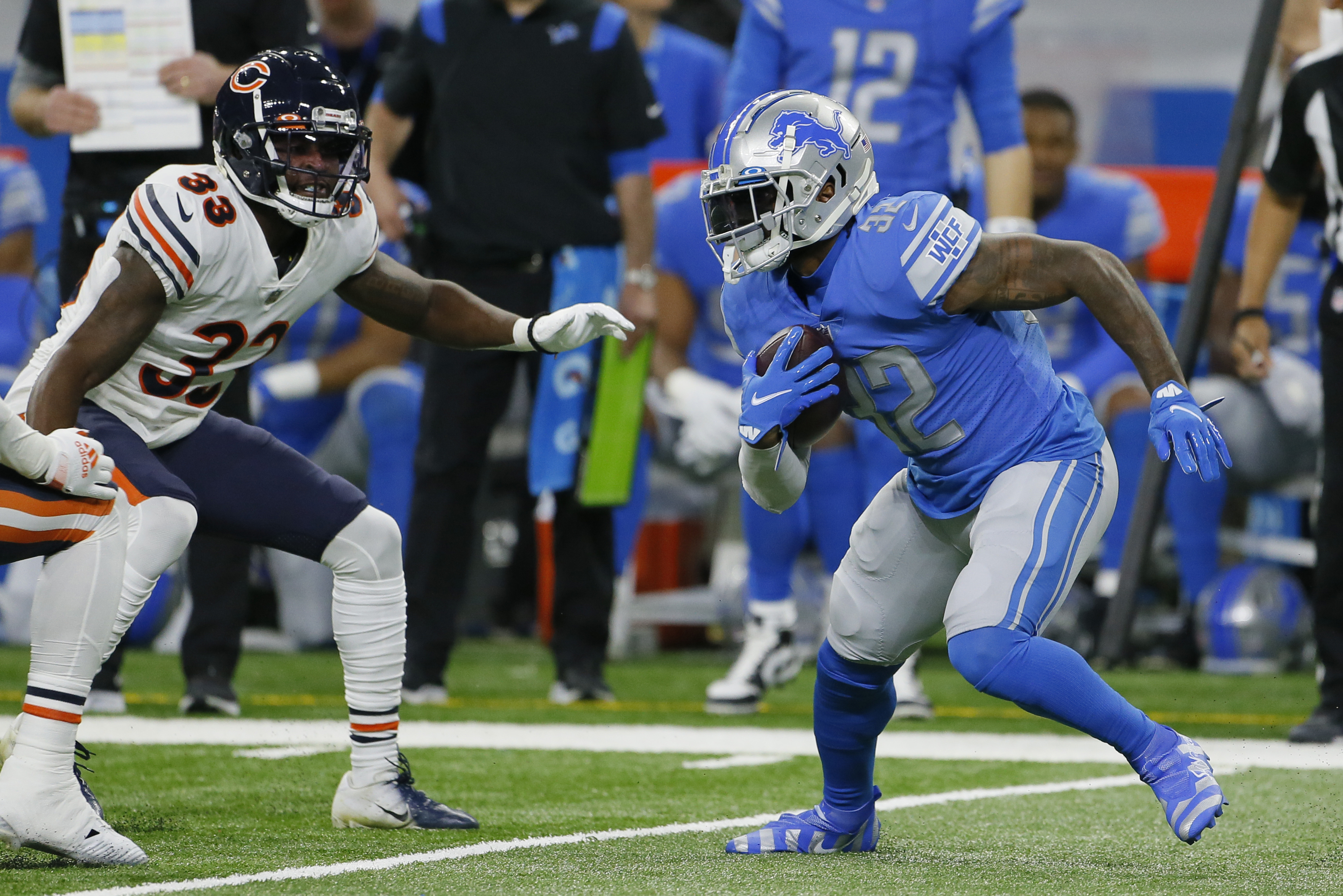 Detroit Lions running back D'Andre Swift (32) is tackled by