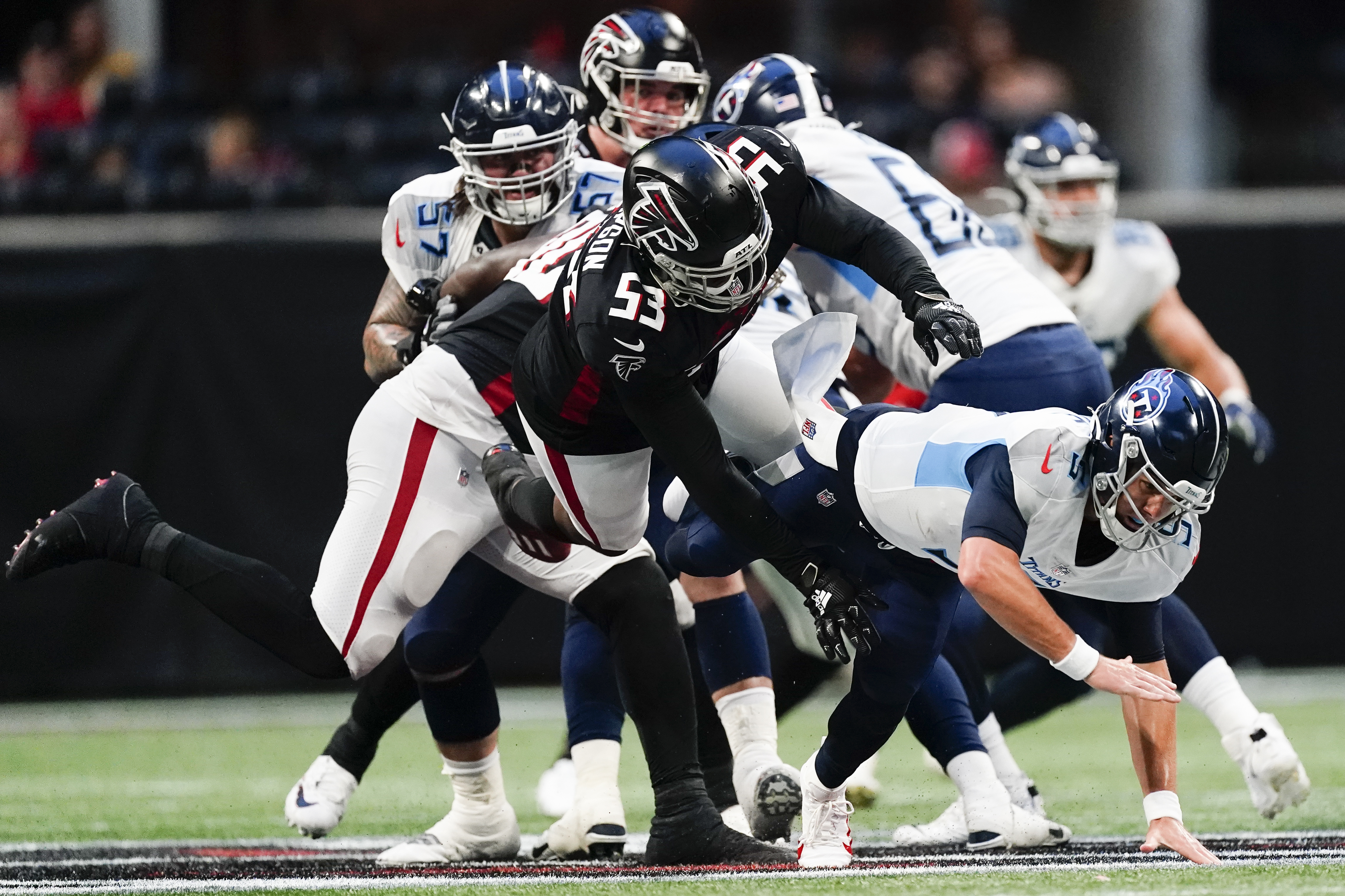 Atlanta Falcons quarterback Logan Woodside (11) calls the count at