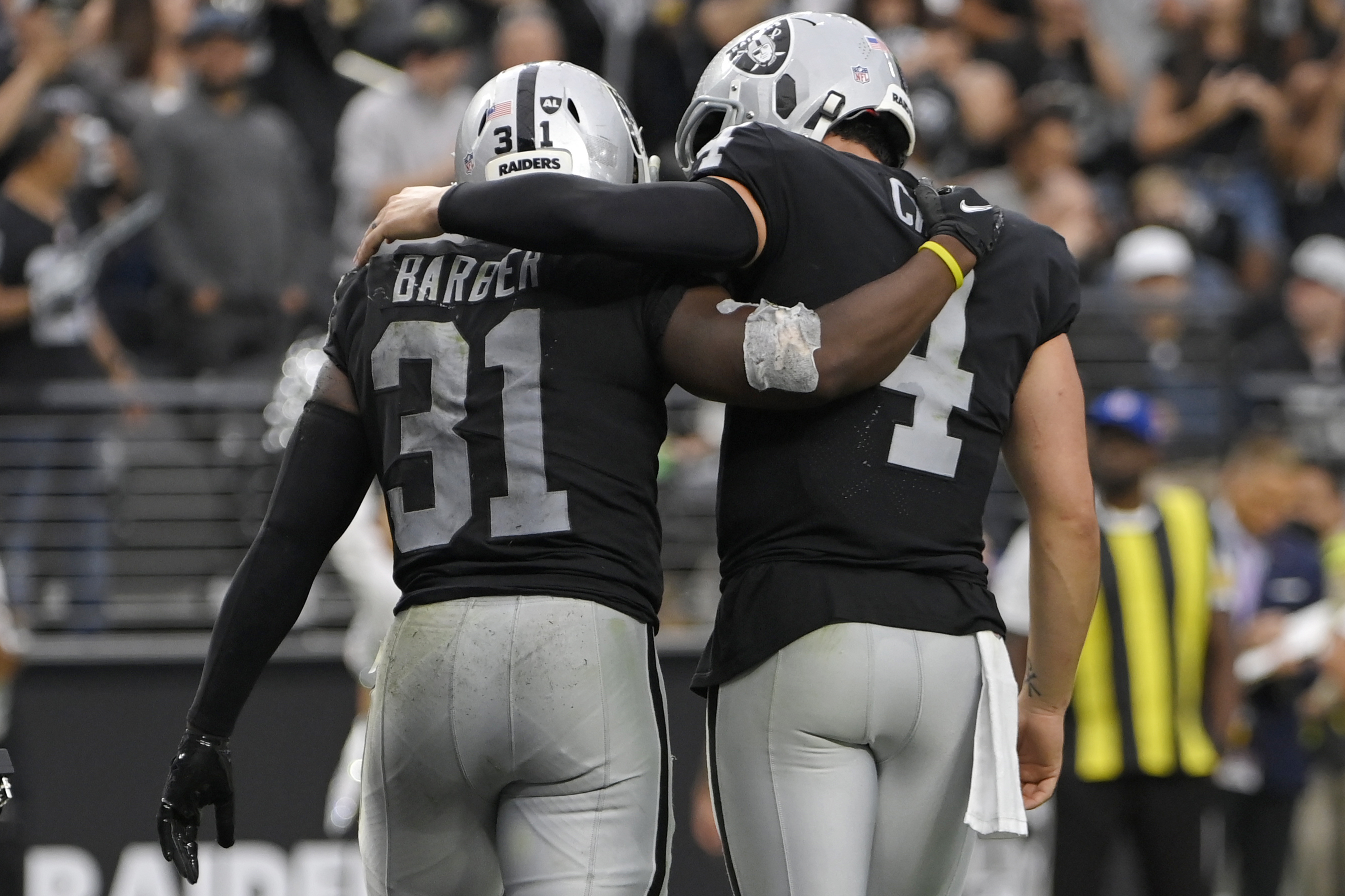 Miami Dolphins running back Malcolm Brown (34) scores a touchdown against  the Las Vegas Raiders during the first half of an NFL football game,  Sunday, Sept. 26, 2021, in Las Vegas. (AP