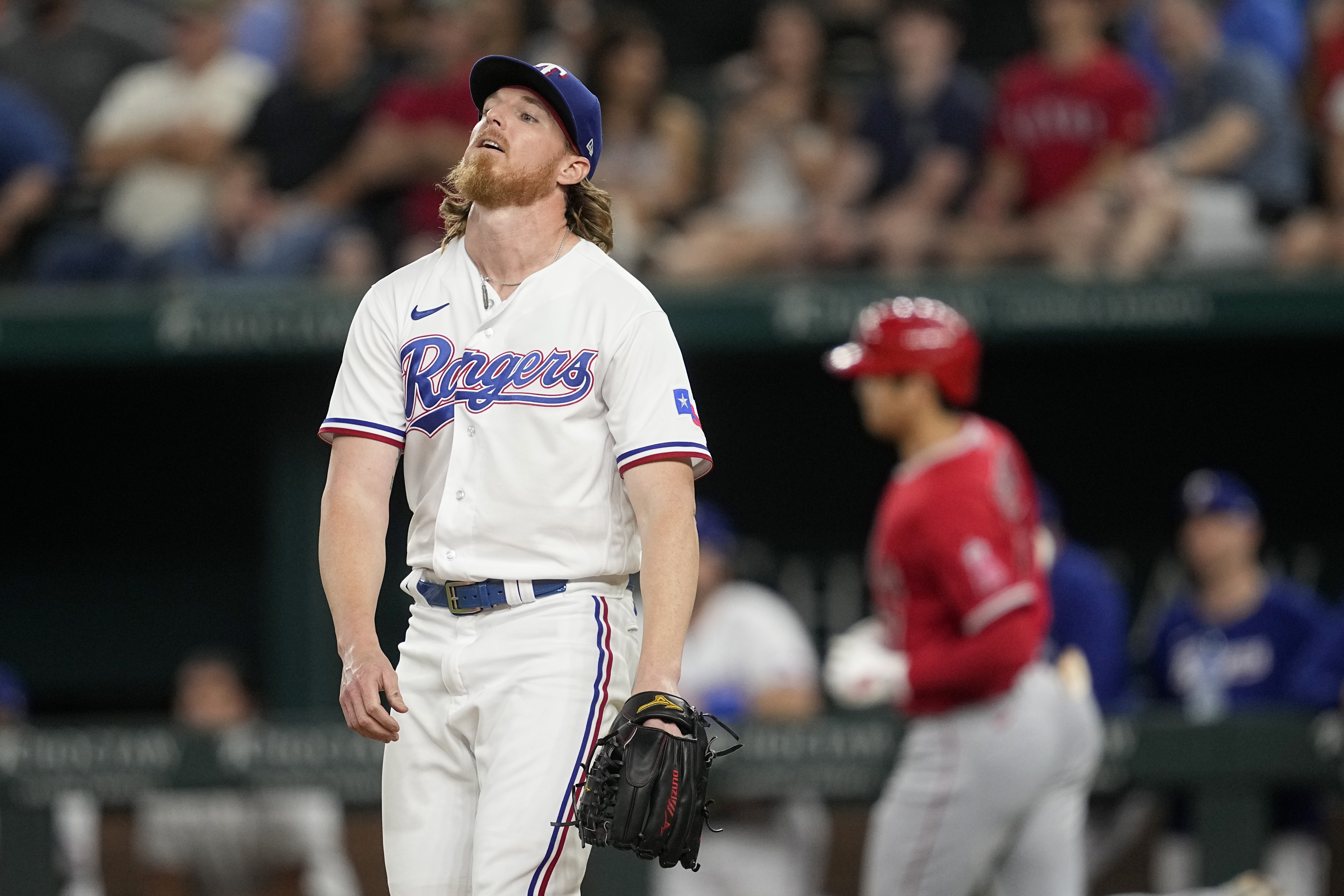 Texas Rangers' Andrew Heaney walks to the dugout before a baseball