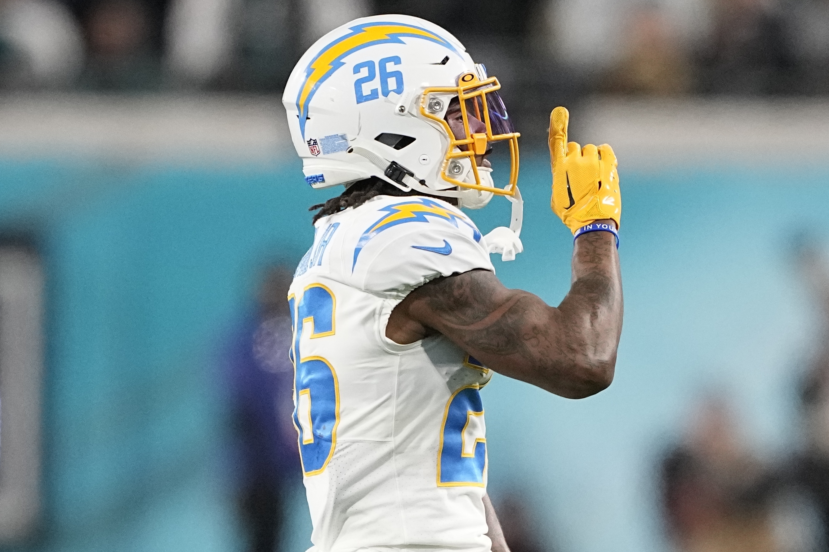 Jacksonville Jaguars running back Travis Etienne Jr. (1) runs the ball  during an NFL wild-card football game against the Los Angeles Chargers,  Saturday, Jan. 14, 2023, in Jacksonville, Fla. The Jaguars defeated