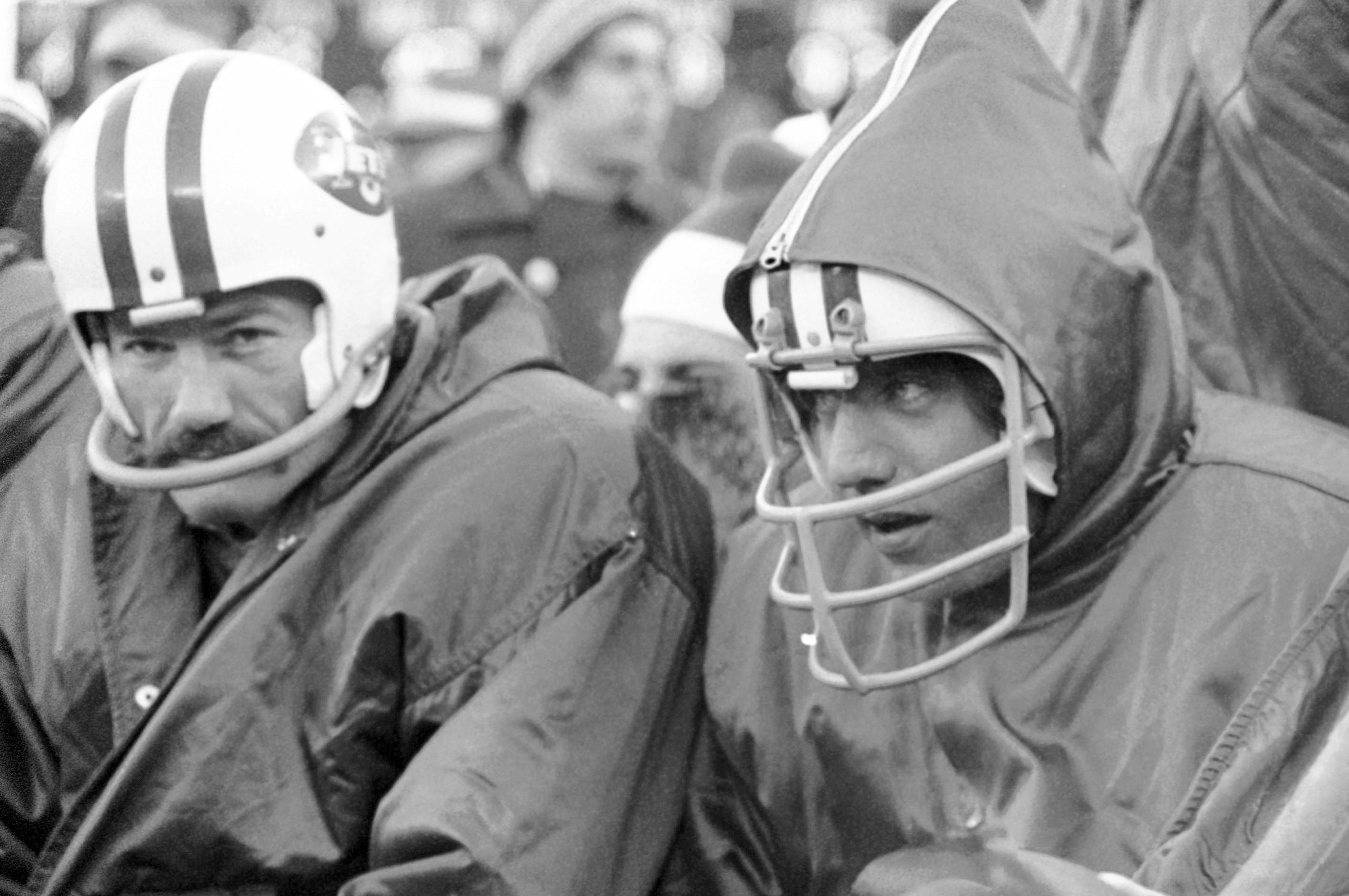 Weeb Ewbank, center, coach of the New York Jets, shows quarterback