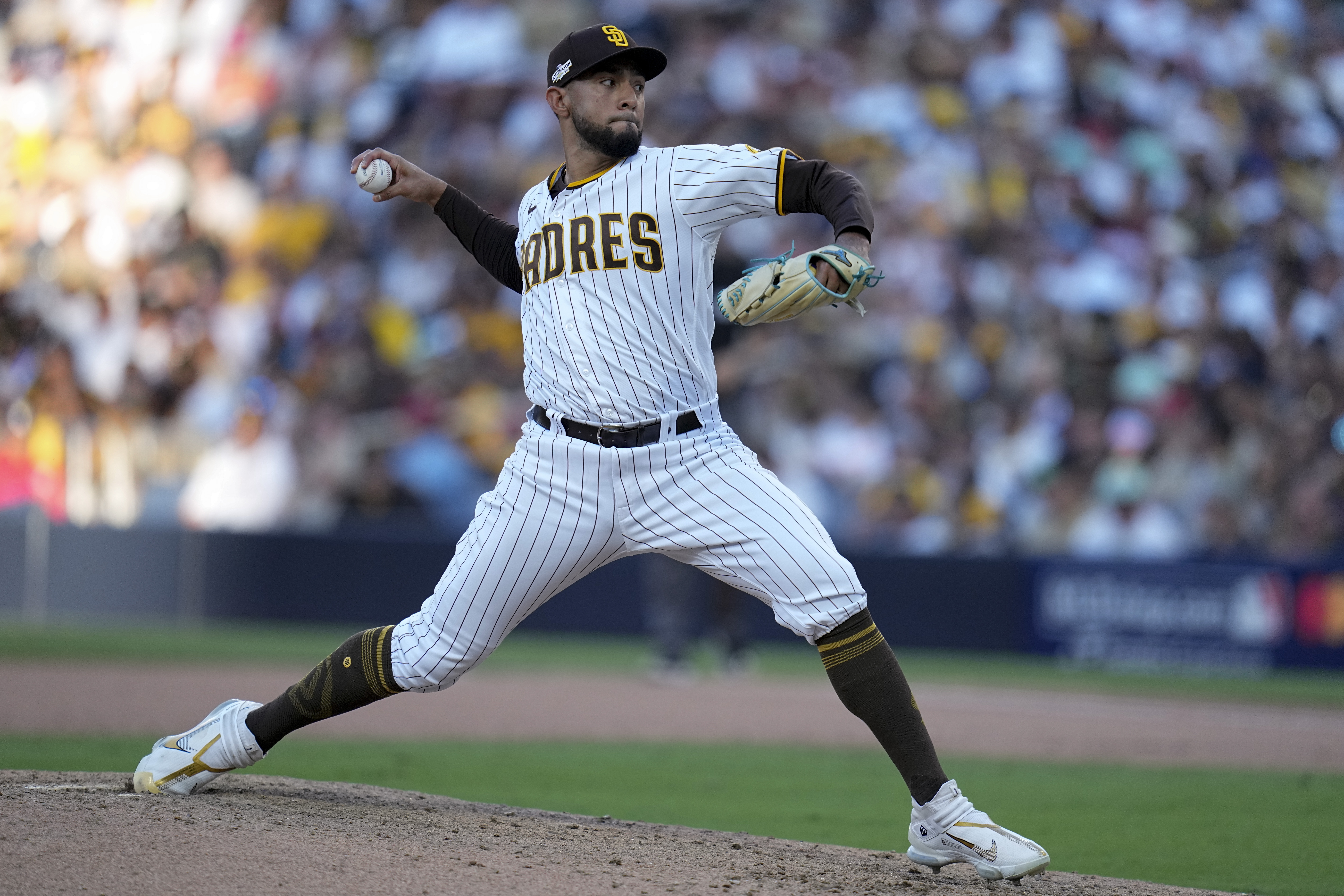 Robert Suarez of the San Diego Padres pitches in the eighth inning
