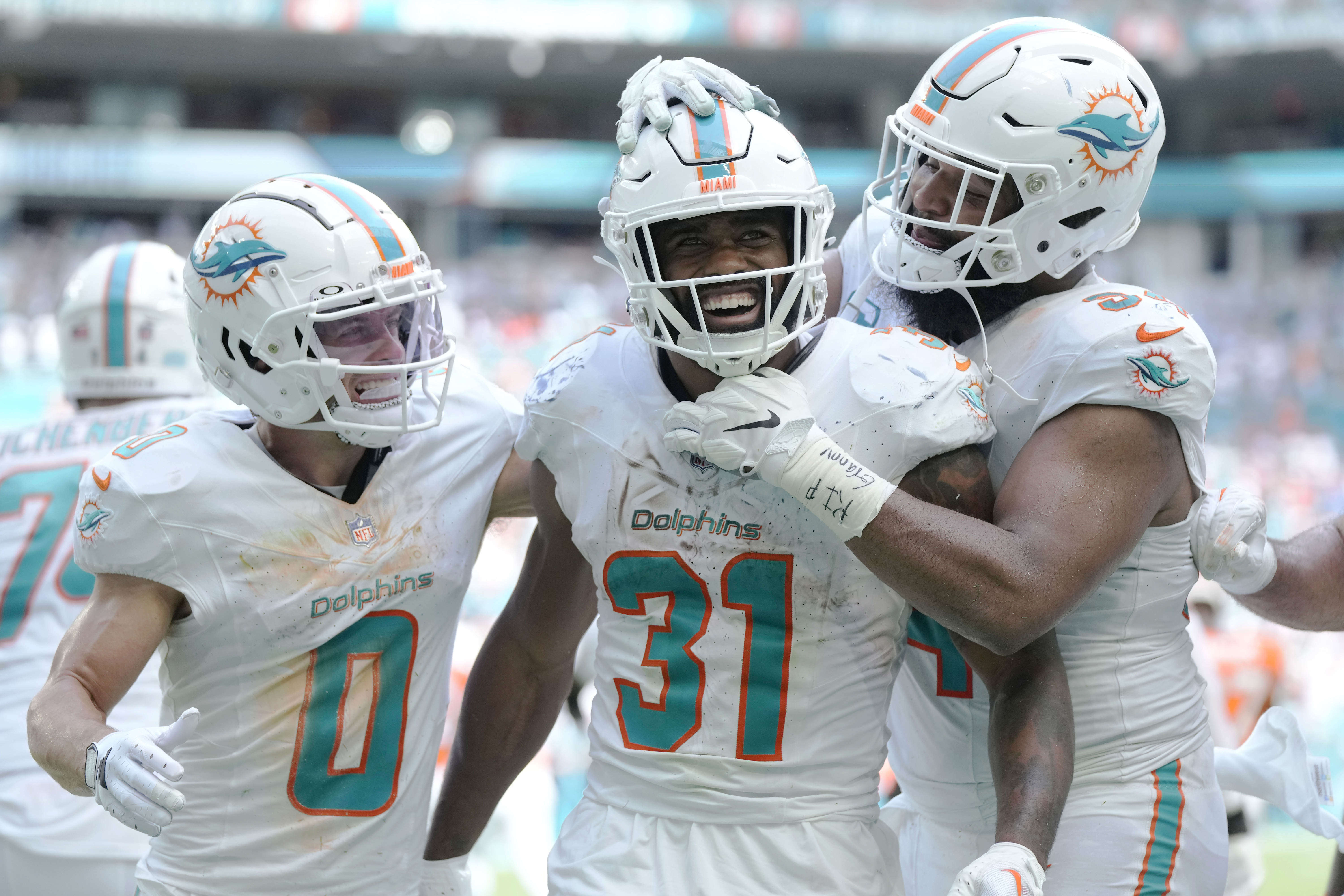 Miami Dolphins running back De'Von Achane (28) celebrates his