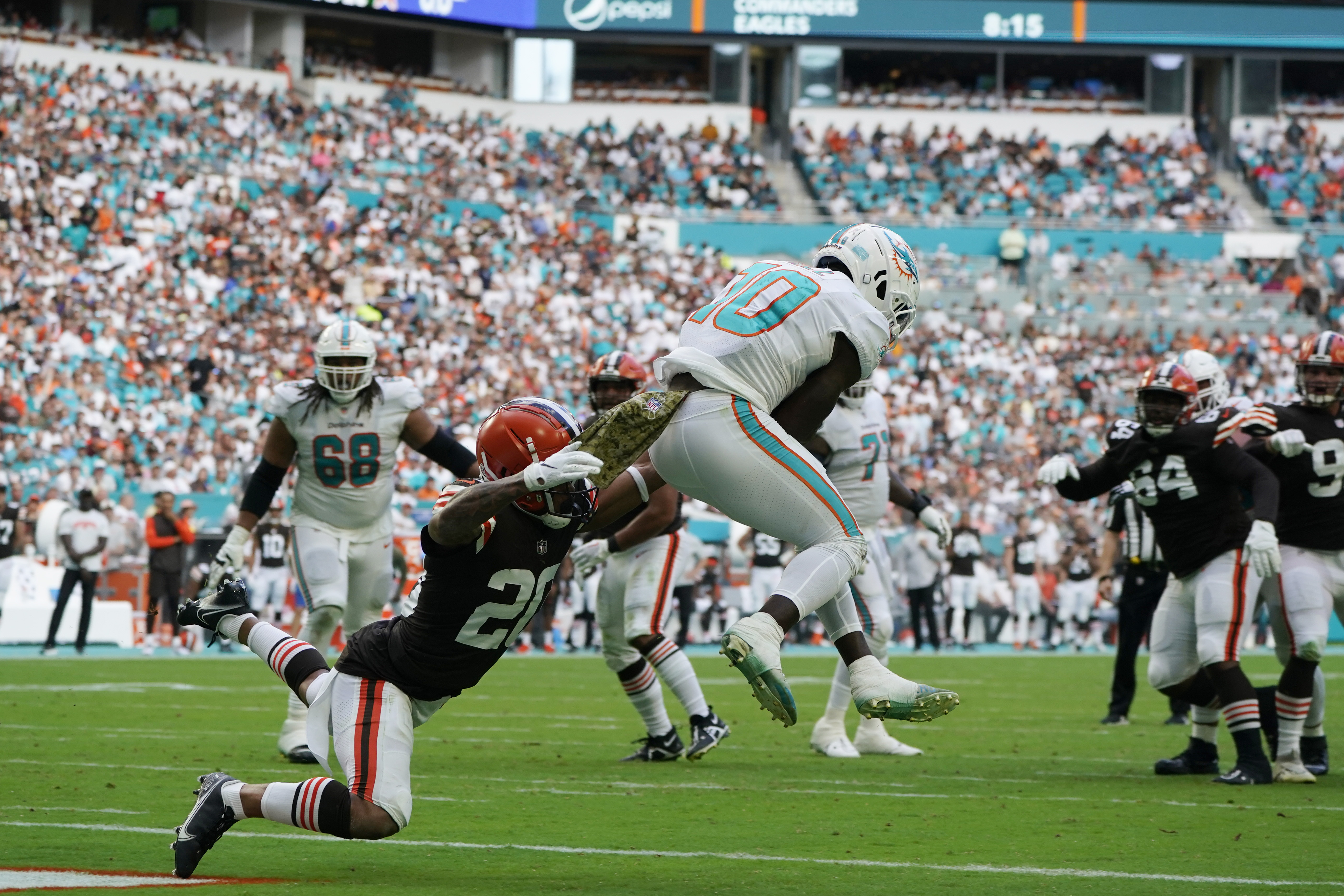 Miami Dolphins fullback Alec Ingold (30) runs with the ball to score a  touchdown during an NFL football game against the Cleveland Browns, Sunday,  Nov. 13, 2022, in Miami Gardens, Fla. (AP