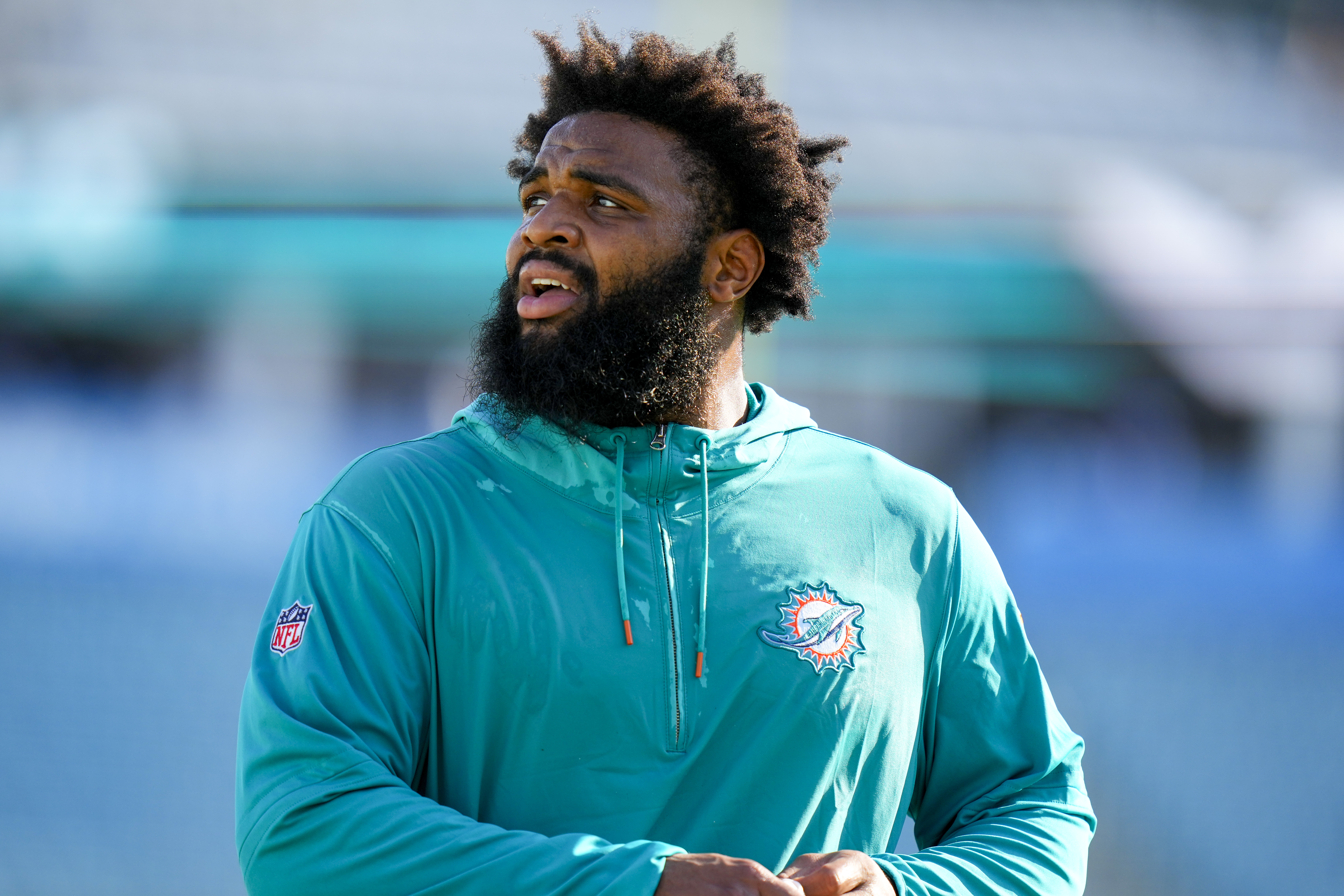 Miami Dolphins defensive tackle Christian Wilkins throws out a ceremonial  first pitch before the start of a baseball game between the Miami Marlins  and the Texas Rangers, Thursday, July 21, 2022, in